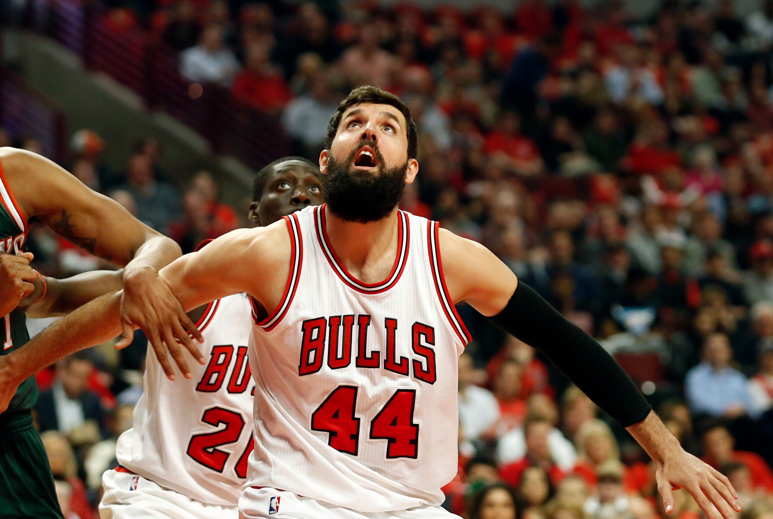 Apr 27, 2015; Chicago, IL, USA; Chicago Bulls forward Nikola Mirotic (44) looks for a rebound against Milwaukee Bucks center John Henson (31) in game five of the first round of the 2015 NBA Playoffs at United Center. Mandatory Credit: Kamil Krzaczynski-US