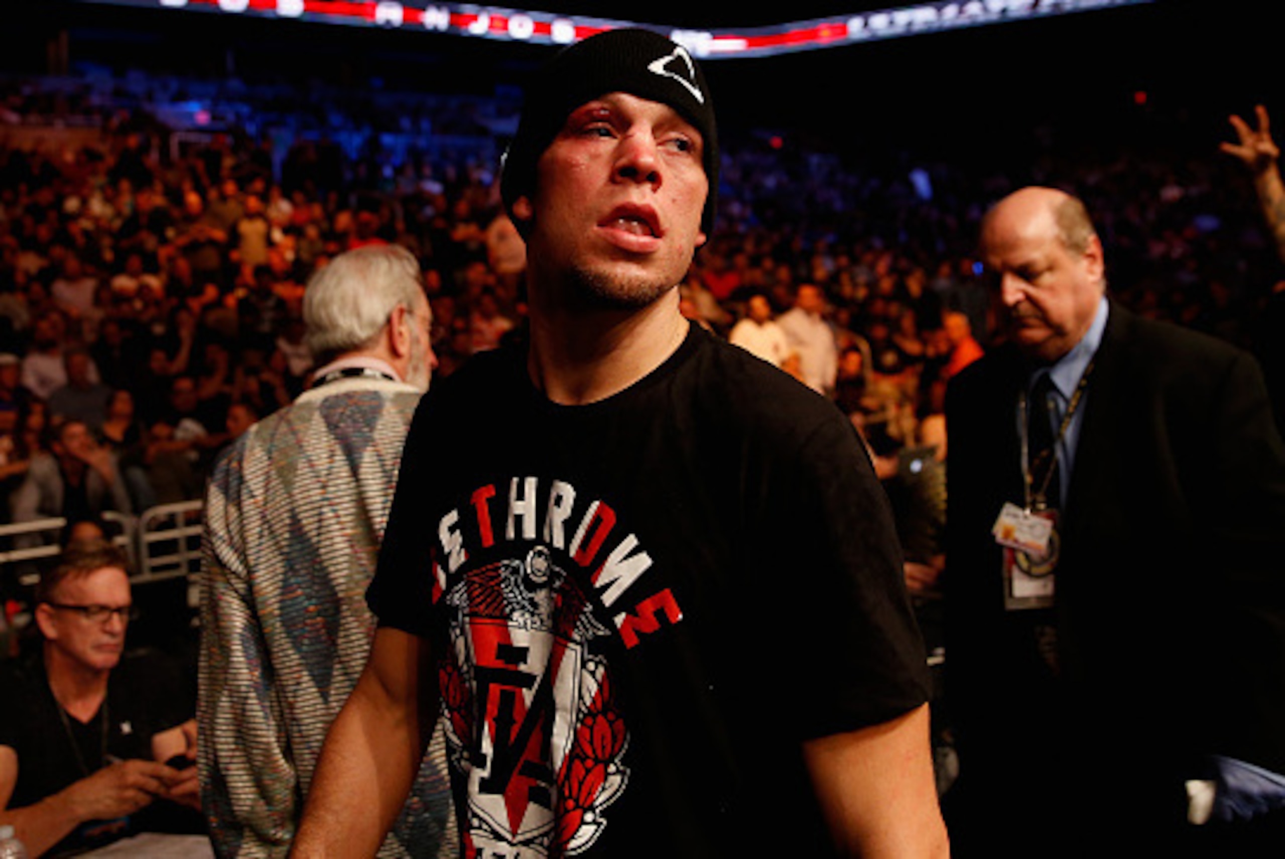 PHOENIX, AZ - DECEMBER 13:  Nate Diaz exits the octagon following his loss by unanimous decision to Rafael dos Anjos (not pictured) in their heavyweight bout during the UFC Fight Night event at the at U.S. Airways Center on December 13, 2014 in Phoenix, A