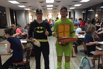 Wyatt Schrepfer and Silas Nacita delivering pizzas