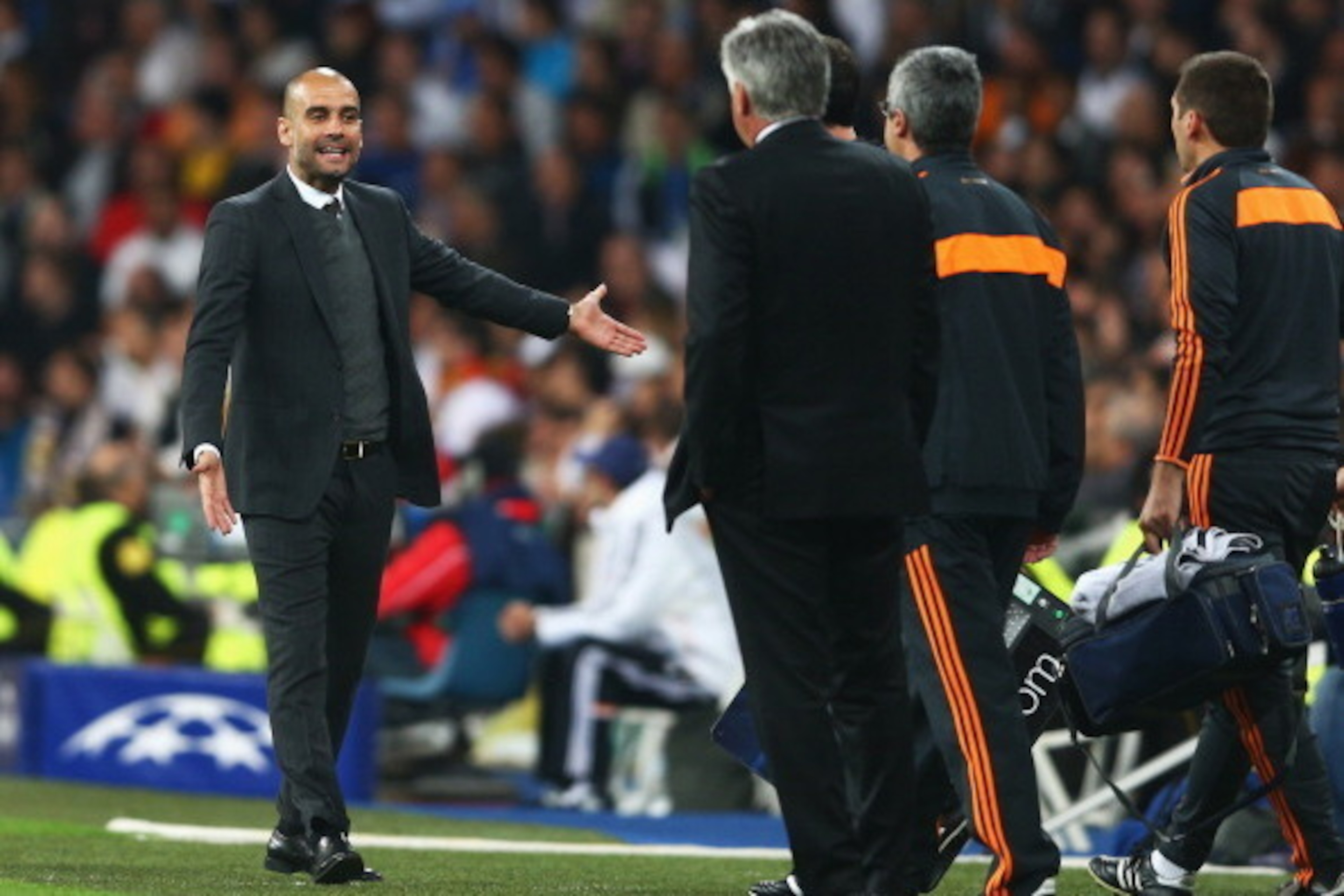 MADRID, SPAIN - APRIL 23:  Josep Guardiola, coach of Bayern Muenchen shows his frustration to Carlo Ancelotti, coach of Real Madrid during the UEFA Champions League semi-final first leg match between Real Madrid and FC Bayern Muenchen at the Estadio Santi