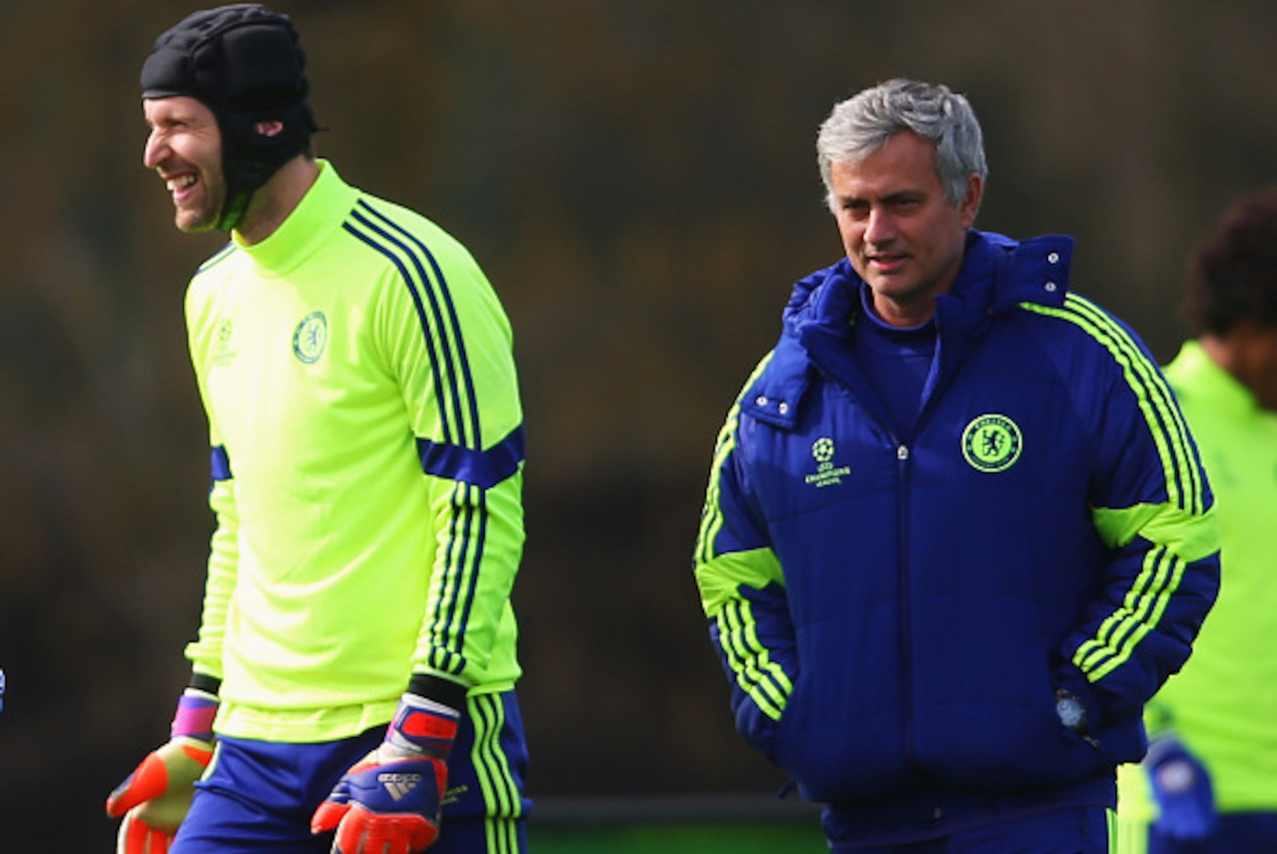 COBHAM, ENGLAND - MARCH 10: Jose Mourinho manager of Chelsea (R) and goalkeeper Petr Cech (2R) smile during a Chelsea training session ahead of the UEFA Champions League Round of 16 second leg match against Paris Saint-Germain at Chelsea Training Ground COBHAM, ENGLAND - MARCH 10: Jose Mourinho manager of Chelsea (R) and goalkeeper Petr Cech (2R) smile during a Chelsea training session ahead of the UEFA Champions League Round of 16 second leg match against Paris Saint-Germain at Chelsea Training Ground