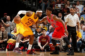 CLEVELAND, OHIO - MAY 6: LeBron James #23 of the Cleveland Cavaliers defends the ball against Jimmy Butler #21 of the Chicago Bulls during Game Two of the Eastern Conference Semifinals during the NBA Playoffs on May 6, 2015 at Quicken Loans Arena in Cleve