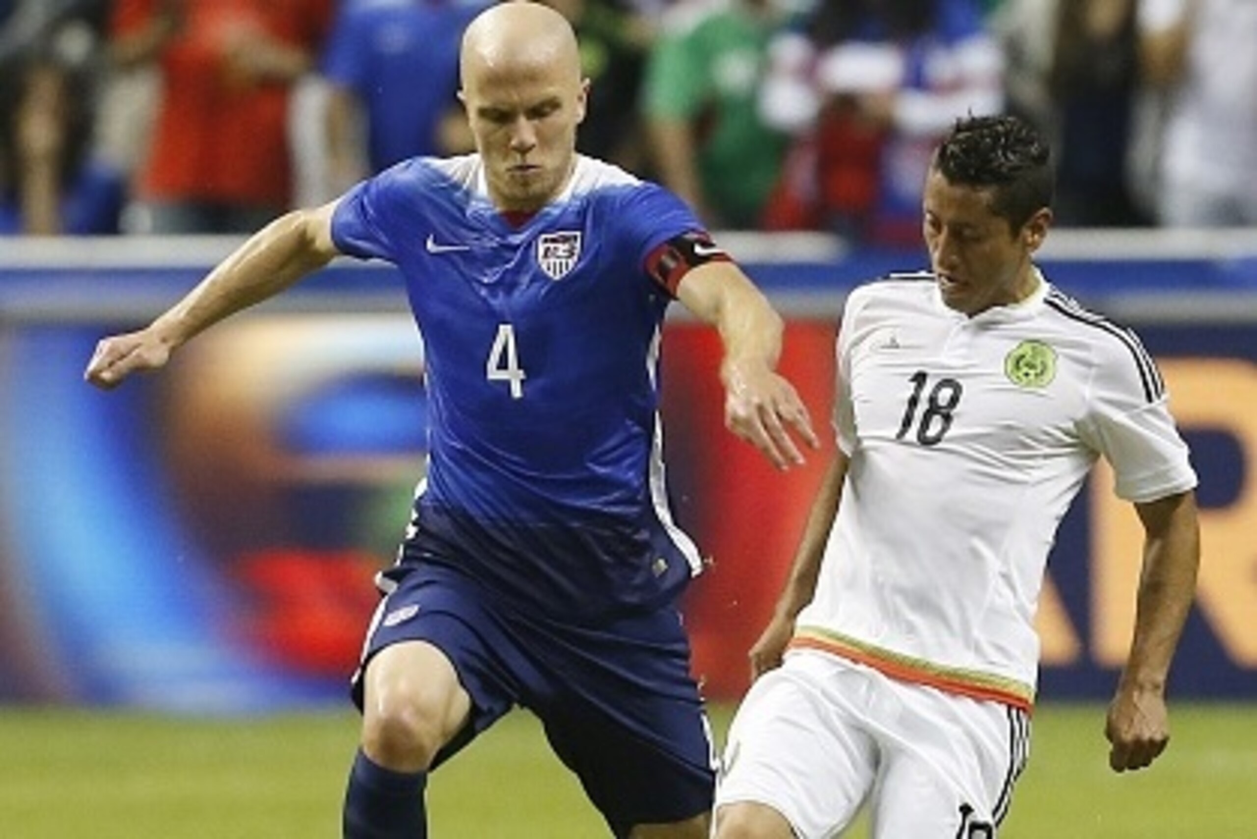 SAN ANTONIO, TX - APRIL 15: Michael Bradley #4 of the United States and Carlos Esquivel #18 of Mexico battles for the ball during an international friendly match at the Alamodome on April 15, 2015 in San Antonio, Texas. (Photo by Chris Covatta/Getty Ima SAN ANTONIO, TX - APRIL 15: Michael Bradley #4 of the United States and Carlos Esquivel #18 of Mexico battles for the ball during an international friendly match at the Alamodome on April 15, 2015 in San Antonio, Texas. (Photo by Chris Covatta/Getty Ima