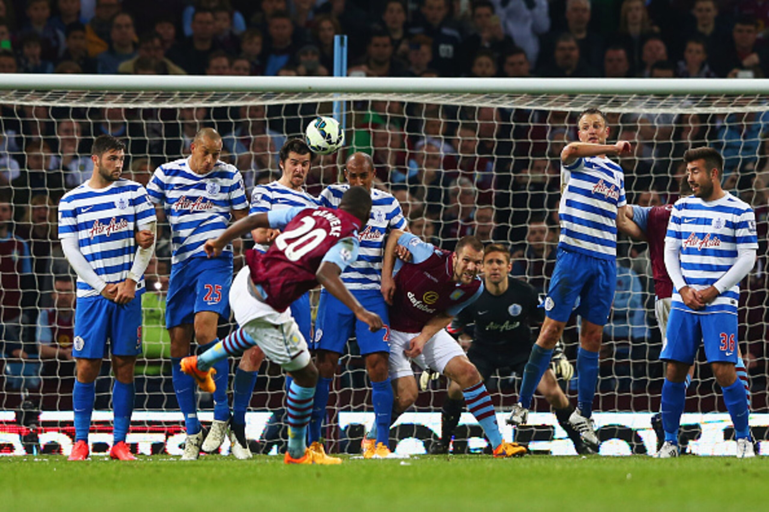 BIRMINGHAM, ENGLAND - APRIL 07:  Christian Benteke of Aston Villa (20) scores their third goal from a free kick and completes his hat trick during the Barclays Premier League match between Aston Villa and Queens Park Rangers at Villa Park on April 7, 2015