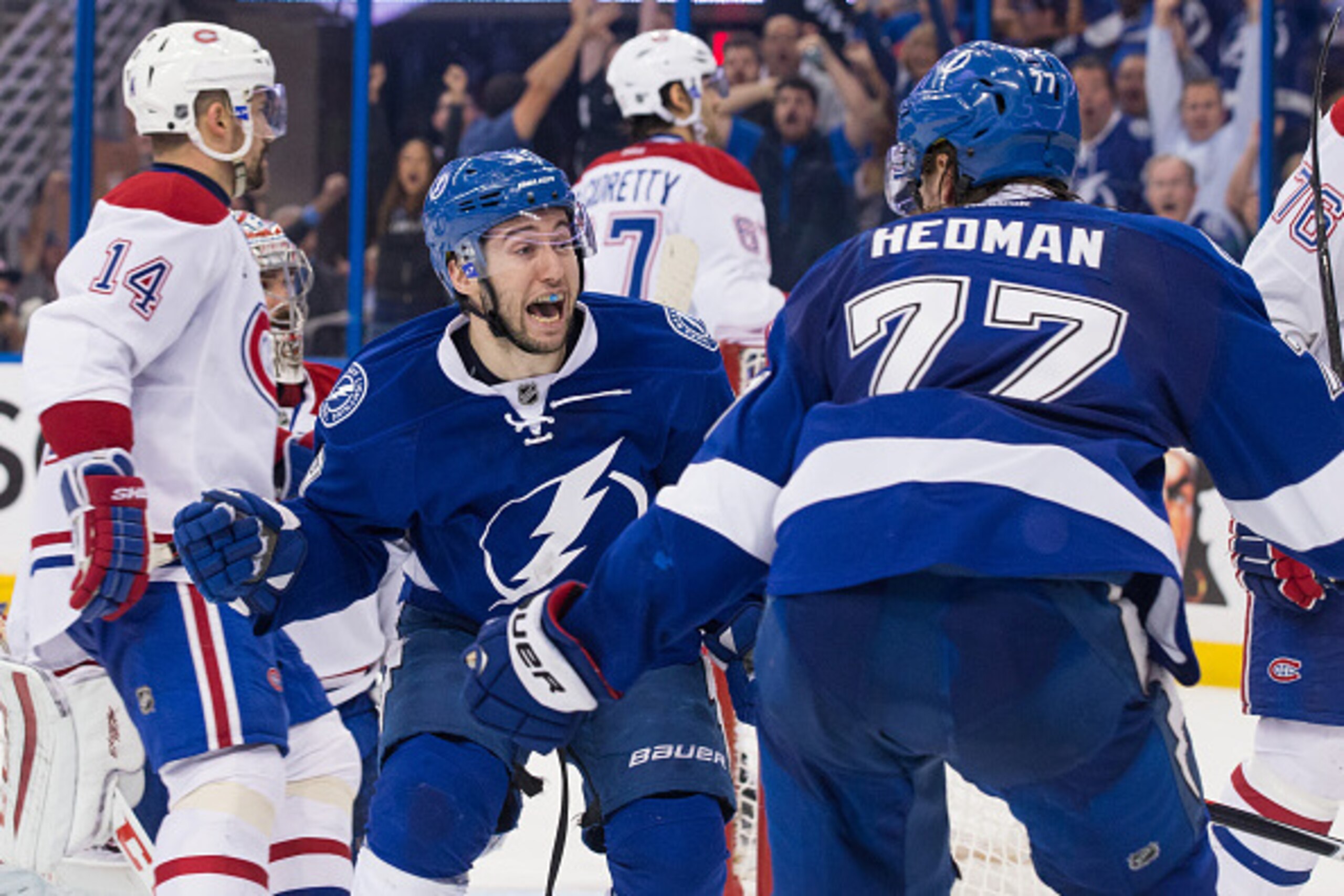TAMPA, FL - May 6: Tyler Johnson #9 of the Tampa Bay Lightning celebrates his game winning goal with teammate Victor Hedman #77 against the Montreal Canadiens during the third period in Game Three of the Eastern Conference Semifinals during the 2015 NHL S