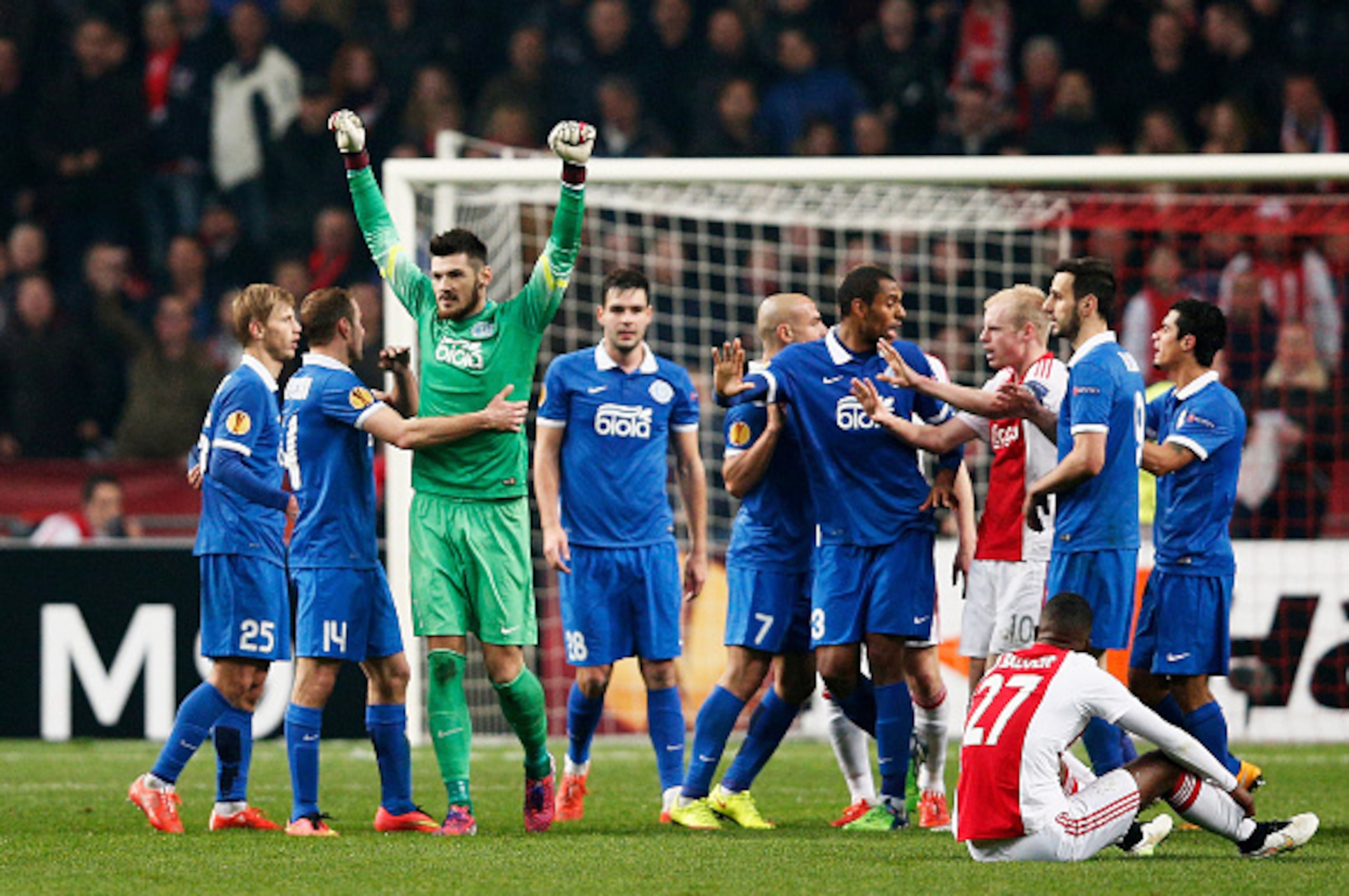 AMSTERDAM, NETHERLANDS - MARCH 19:  Dnipro players celebrate as they advance to the next round on away goals during the UEFA Europa League Round of 16, second leg match between AFC Ajax v FC Dnipro Dnipropetrovsk at Amsterdam Arena on March 19, 2015 in Am