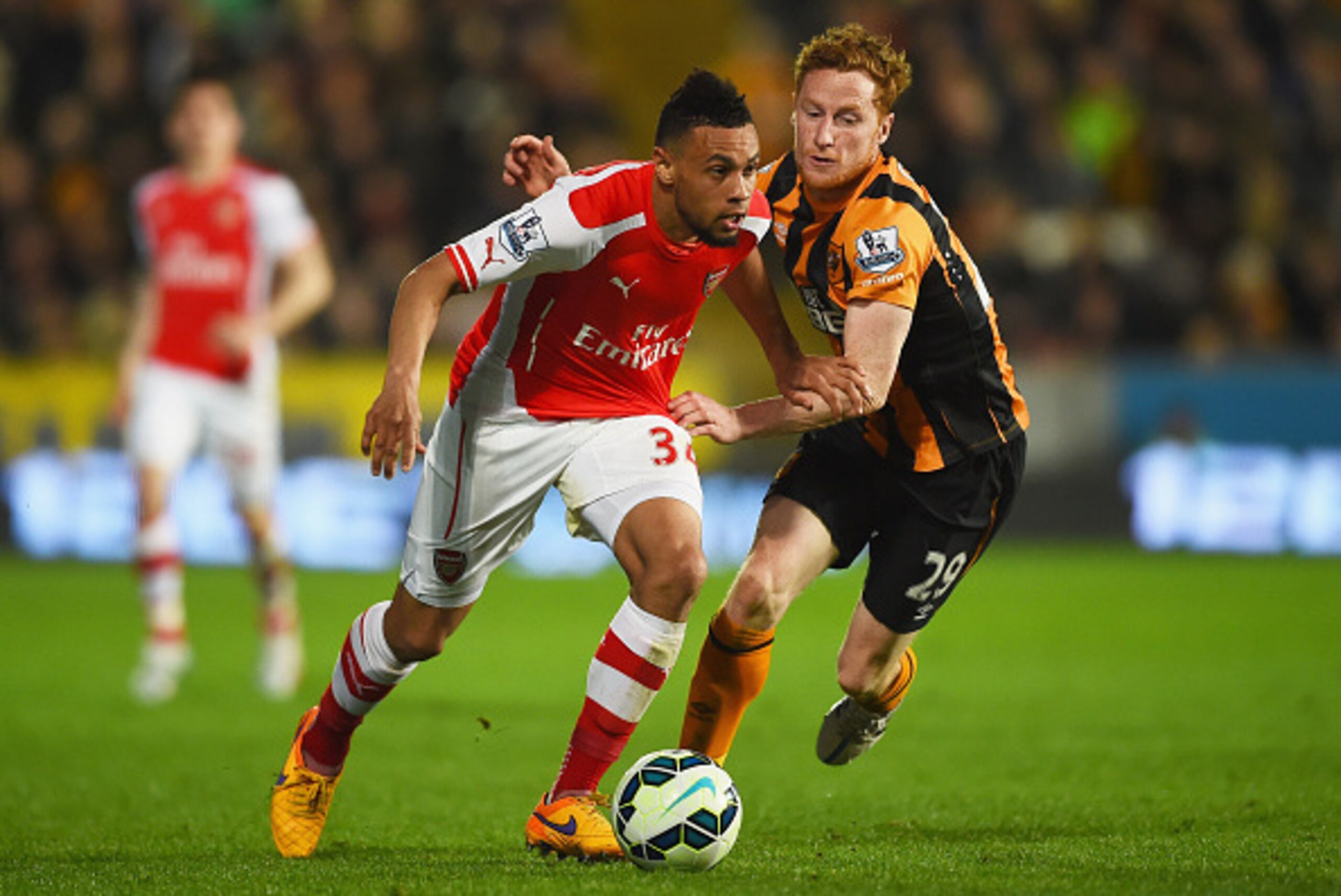 HULL, ENGLAND - MAY 04:  Francis Coquelin of Arsenal battles with Stephen Quinn of Hull City during the Barclays Premier League match between Hull City and Arsenal at KC Stadium on May 4, 2015 in Hull, England.  (Photo by Laurence Griffiths/Getty Images)
