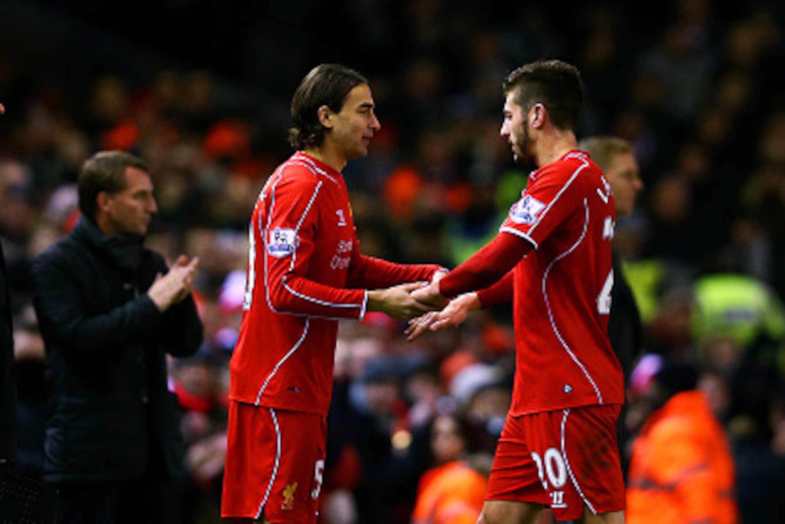 LIVERPOOL, ENGLAND - DECEMBER 29:  Adam Lallana of Liverpool is substituted for Lazar Markovic of Liverpool during the Barclays Premier League match between Liverpool and Swansea City at Anfield on December 29, 2014 in Liverpool, England.  (Photo by Clive