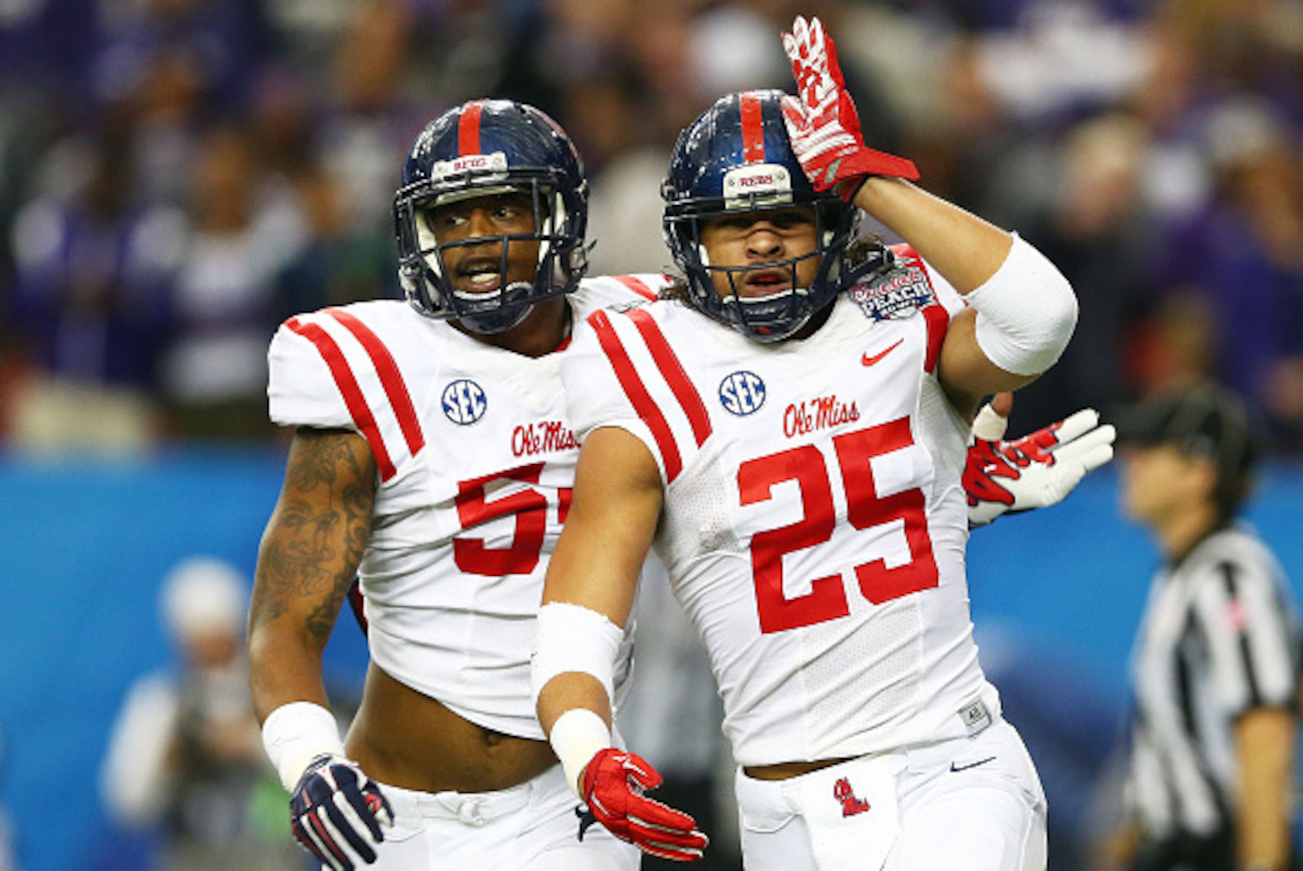 ATLANTA, GA - DECEMBER 31:  Cody Prewitt #25 celebrates his interception with Carlos Thompson #54 of the Ole Miss Rebels in the second quarter against the TCU Horned Frogs during the Chik-fil-A Peach Bowl at Georgia Dome on December 31, 2014 in Atlanta, G