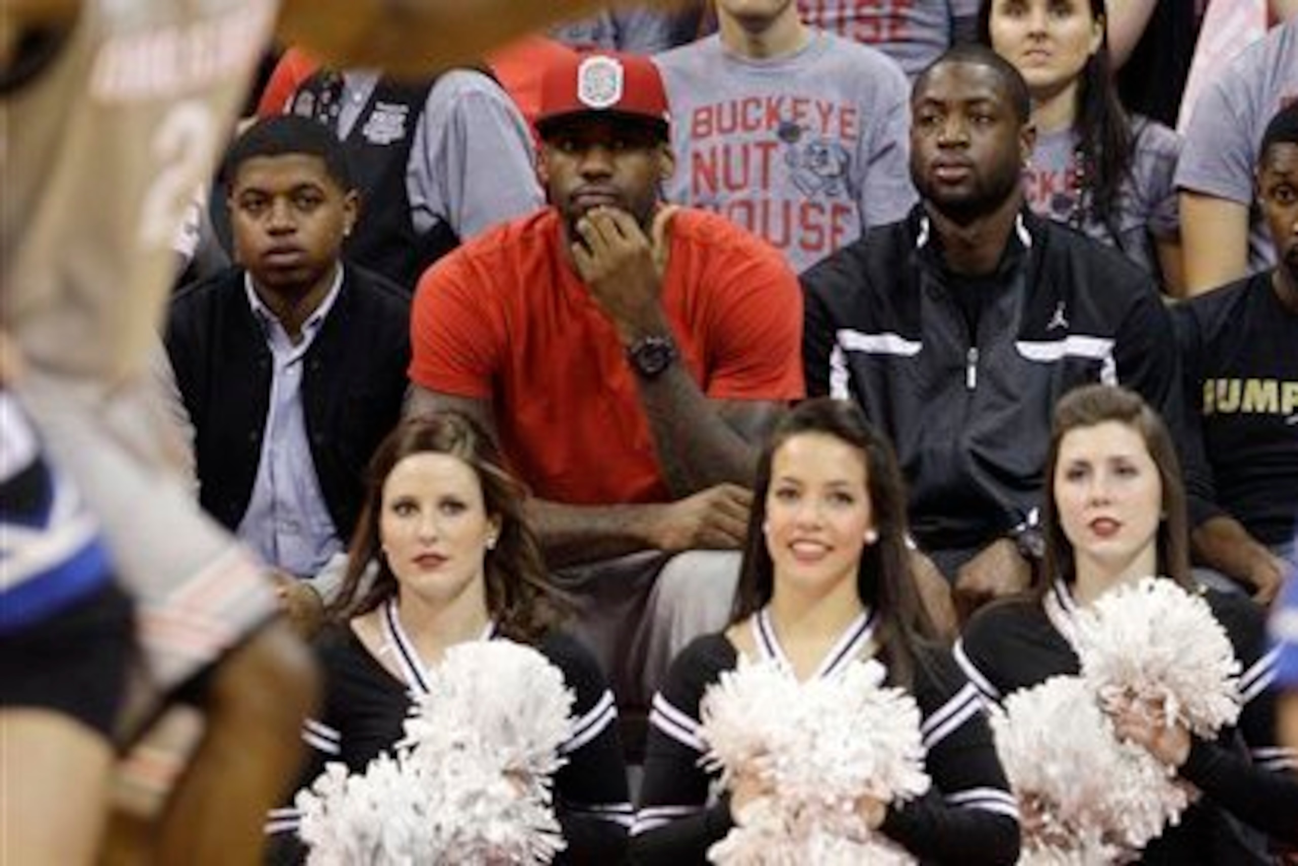 LeBron James attends an Ohio State basketball game with Dwyane Wade in 2011.