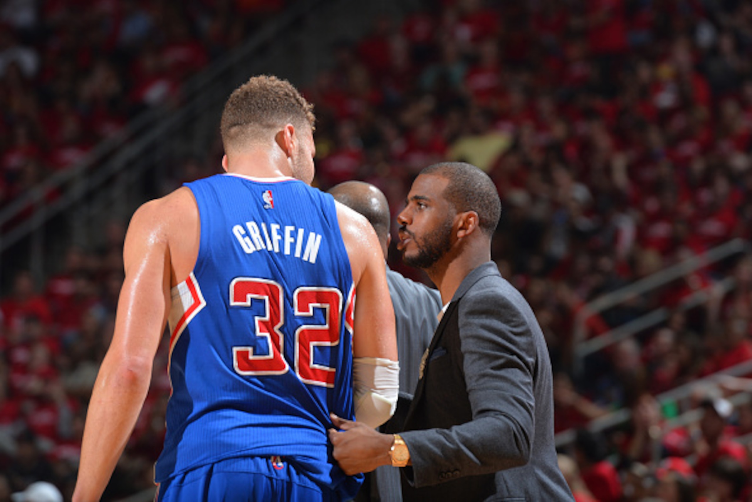 HOUSTON,TX : Blake Griffin #32 of the Los Angeles Clippers gets instruction from Chris Paul #3 against the Houston Rockets at the Toyota Center During Game Two of the Western Conference Semifinals during the 2015 NBA Playoffs on May 6, 2015 in Houston,Tex