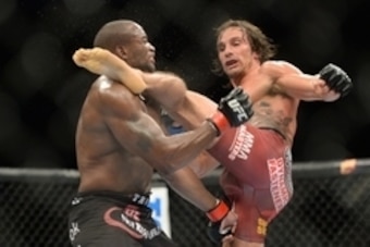 Dec 6, 2014; Las Vegas, NV, USA; Eddie Gordon (red) and Josh Samman (blue) during UFC 181 at Madalay Bay Events Center. Samman won via second round KO. Mandatory Credit: Joe Camporeale-USA TODAY Sports