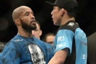 Apr 25, 2015; Montreal, Quebec, CAN; Demetrious Johnson (red) and Kyoji Horiguchi (blue) congratulate each other after their fight during their flyweight bout during UFC 186 at Bell Centre. Mandatory Credit: Eric Bolte-USA TODAY Sports
