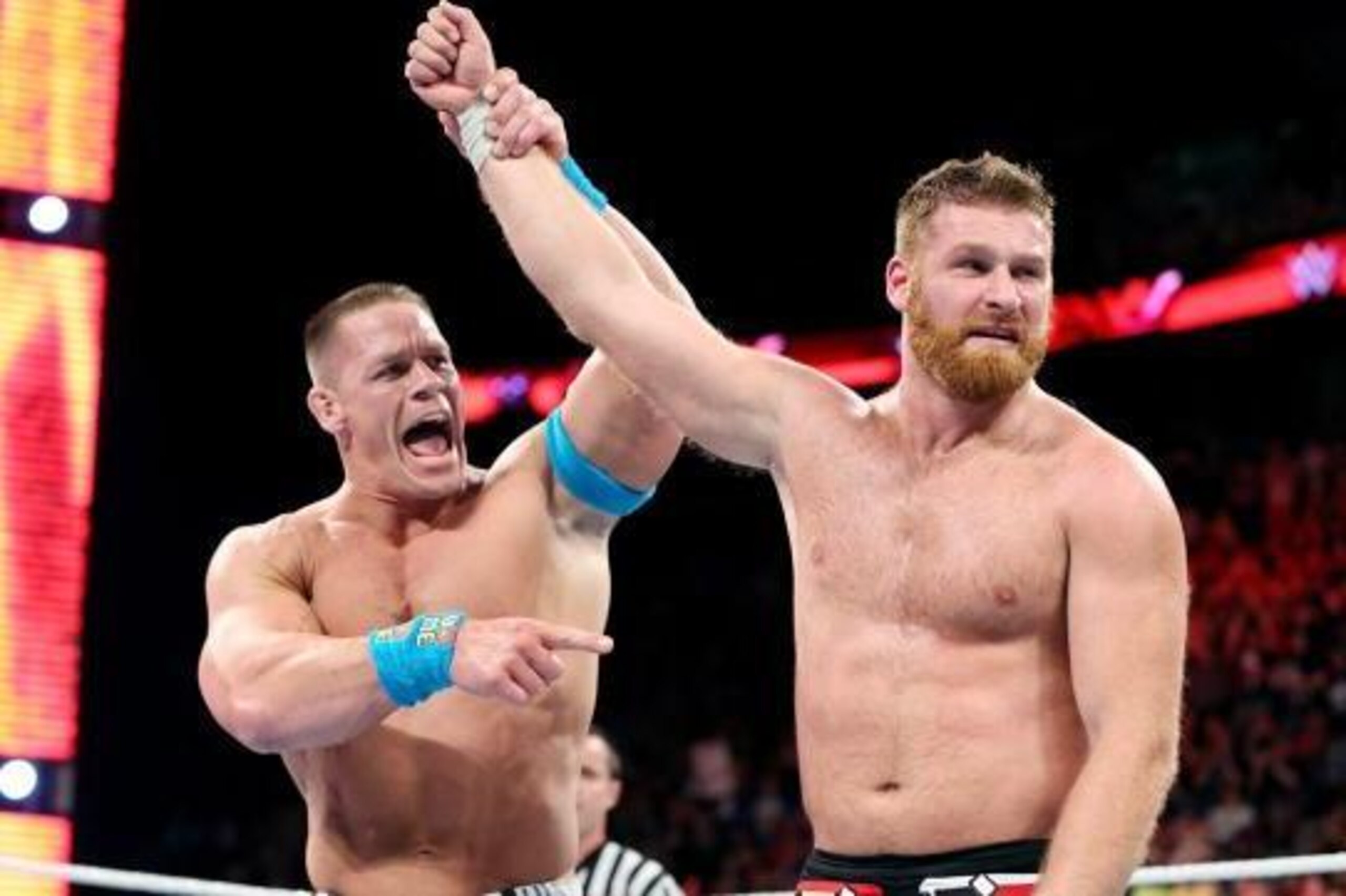John Cena congratulates Sami Zayn. John Cena congratulates Sami Zayn.