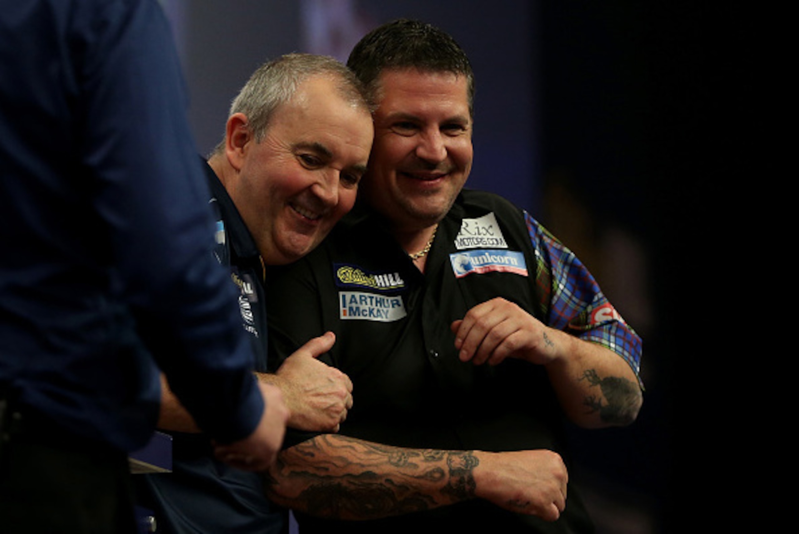 LONDON, ENGLAND - JANUARY 04: Phil Taylor of England and Gary Anderson of Scotland share a joke following the final of the 2015 William Hill PDC World Darts Championships at Alexandra Palace on January 4, 2015 in London, England. (Photo by Ben Hoskins LONDON, ENGLAND - JANUARY 04: Phil Taylor of England and Gary Anderson of Scotland share a joke following the final of the 2015 William Hill PDC World Darts Championships at Alexandra Palace on January 4, 2015 in London, England. (Photo by Ben Hoskins