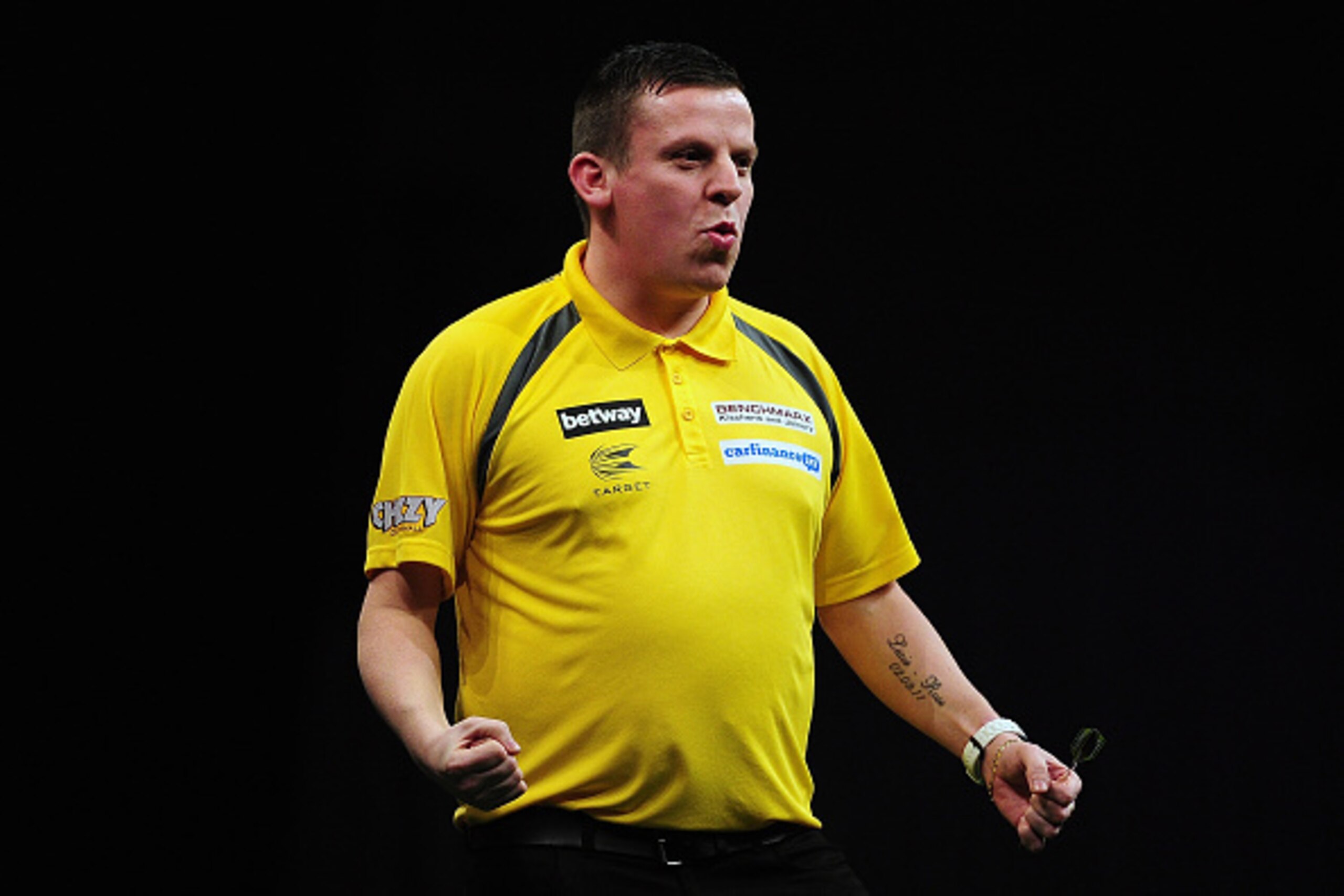 EXETER, ENGLAND - MARCH 05: Dave Chisnall of England celebrates his victory over Gary Anderson of Scotland during The Betway Premier League Darts at Westpoint Arena on March 5, 2015 in Exeter, England. (Photo by Dan Mullan/Getty Images) EXETER, ENGLAND - MARCH 05: Dave Chisnall of England celebrates his victory over Gary Anderson of Scotland during The Betway Premier League Darts at Westpoint Arena on March 5, 2015 in Exeter, England. (Photo by Dan Mullan/Getty Images)