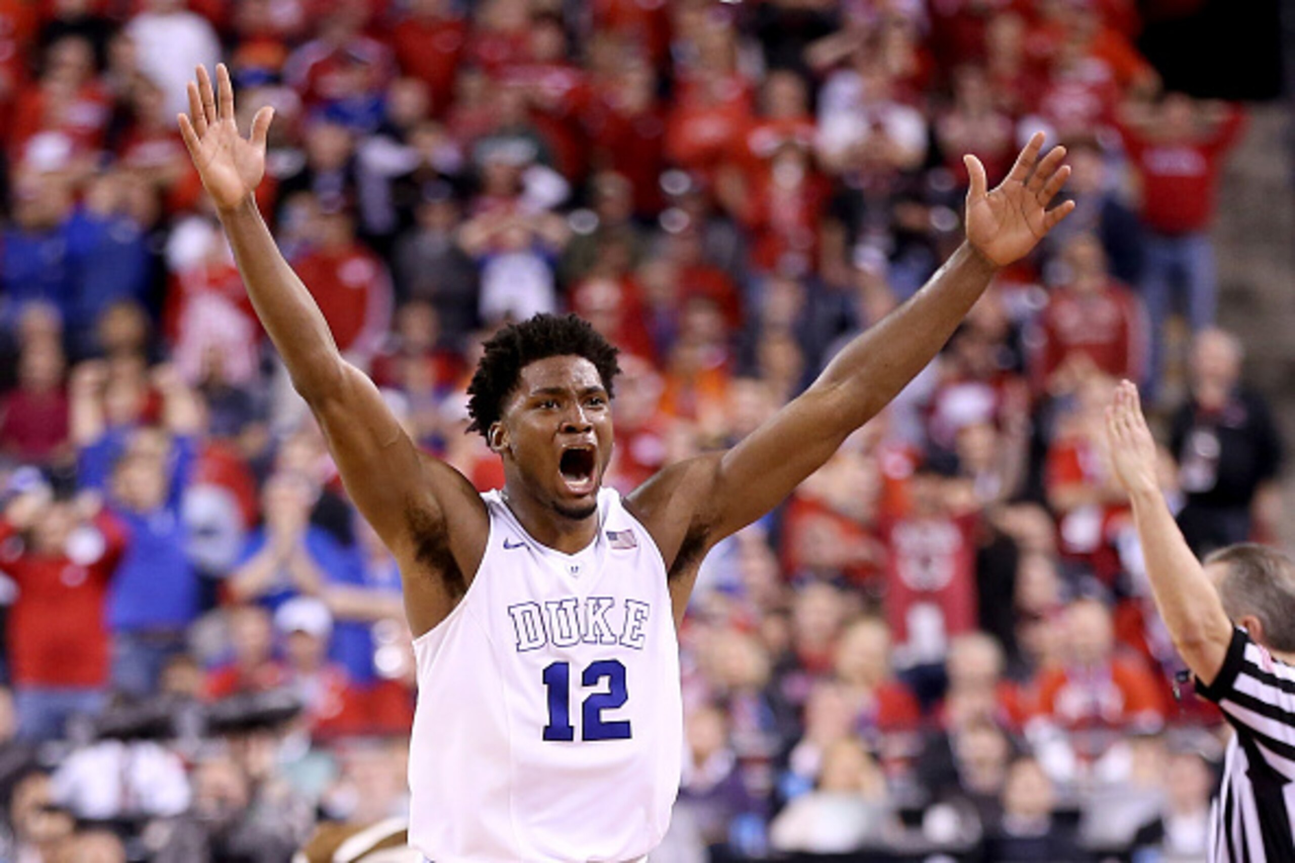 INDIANAPOLIS, IN - APRIL 06: Justise Winslow #12 of the Duke Blue Devils celebrates after defeating the Wisconsin Badgers during the NCAA Men's Final Four National Championship at Lucas Oil Stadium on April 6, 2015 in Indianapolis, Indiana. Duke defeated 