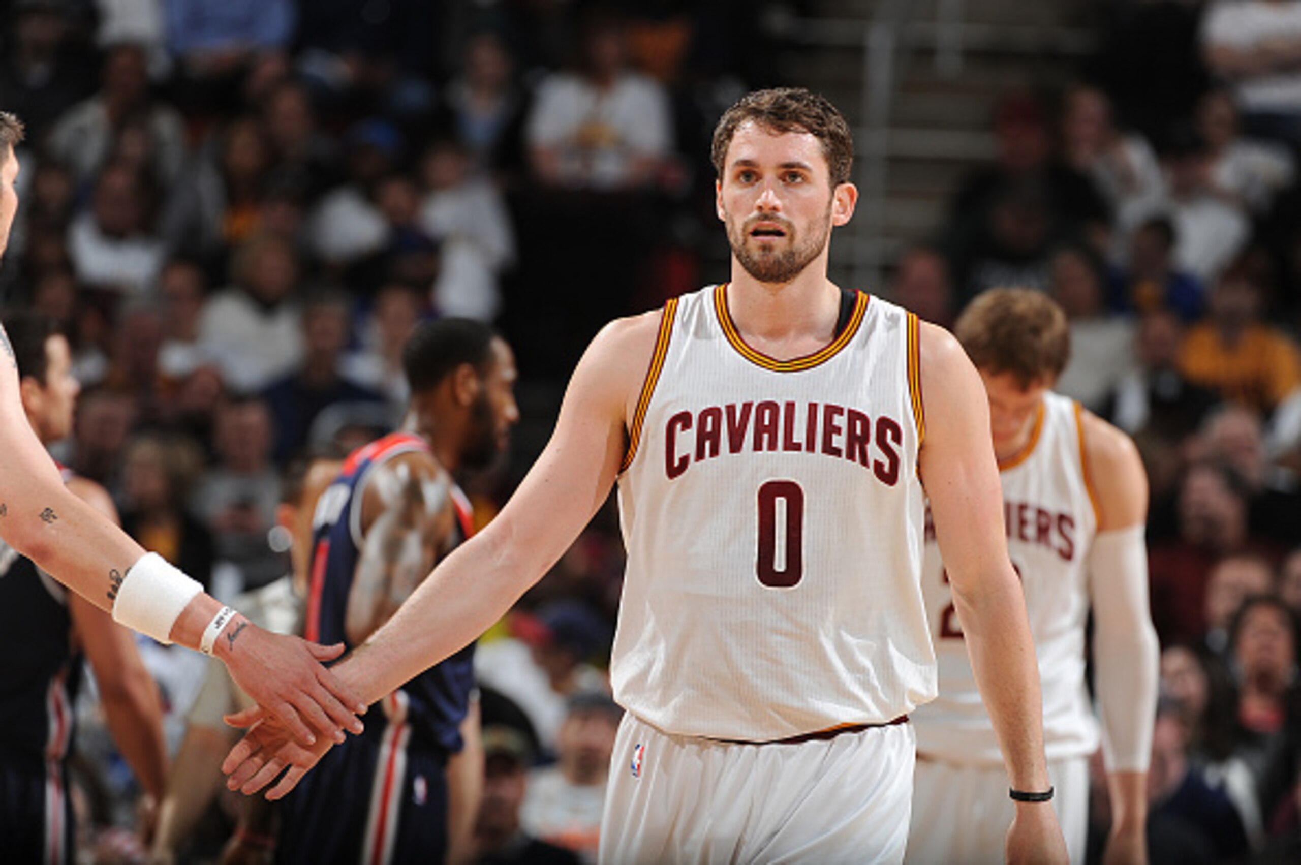 CLEVELAND, OH - APRIL 15:  Kevin Love #0 of the Cleveland Cavaliers shakes hands with his teammates during the game against the Washington Wizards on April 15, 2015 at Quicken Loans Arena in Cleveland, Ohio. NOTE TO USER: User expressly acknowledges and a
