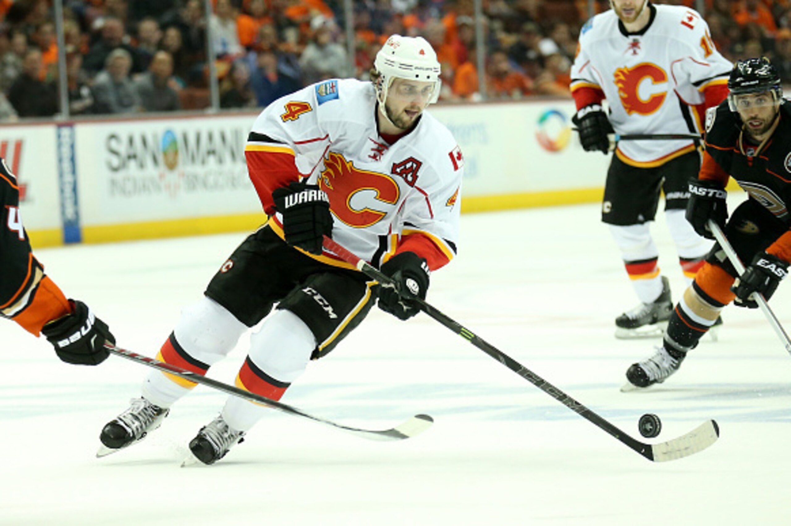 ANAHEIM, CA - MAY 03: Kris Russell #4 of the Calgary Flames slates with the puck against the Anaheim Ducks in Game Two of the Western Conference Semifinals during the 2015 NHL Stanley Cup Playoffs at Honda Center on May 3, 2015 in Anaheim, California.  (P