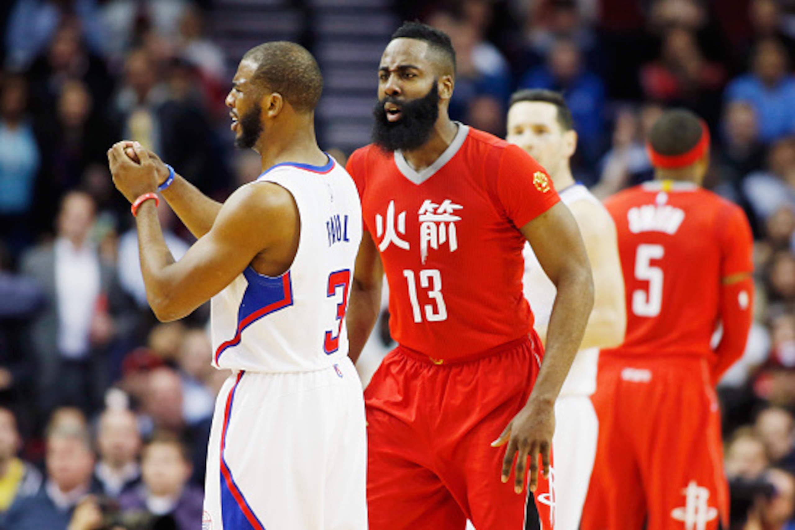 HOUSTON, TX - FEBRUARY 25:  James Harden #13 of the Houston Rockets shouts at  Chris Paul #3 of the Los Angeles Clippers after a foul during their game at the Toyota Center on February 25, 2015 in Houston, Texas. NOTE TO USER: User expressly acknowledges 