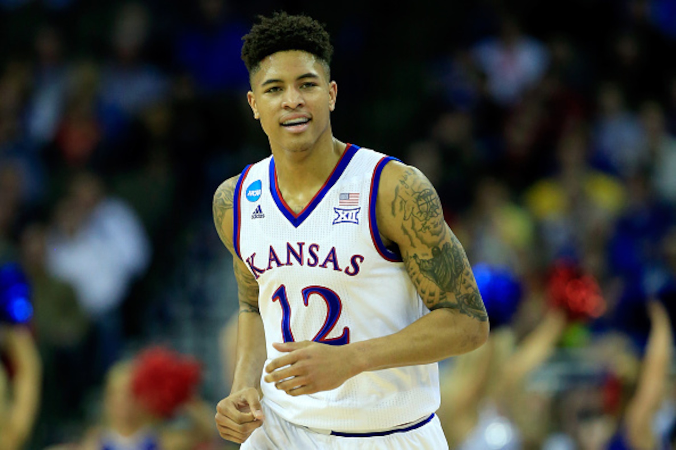 OMAHA, NE - MARCH 20: Kelly Oubre Jr. #12 of the Kansas Jayhawks reacts against the New Mexico State Aggies during the second round of the 2015 NCAA Men's Basketball Tournament at the CenturyLink Center on March 20, 2015 in Omaha, Nebraska.  (Photo by Jam