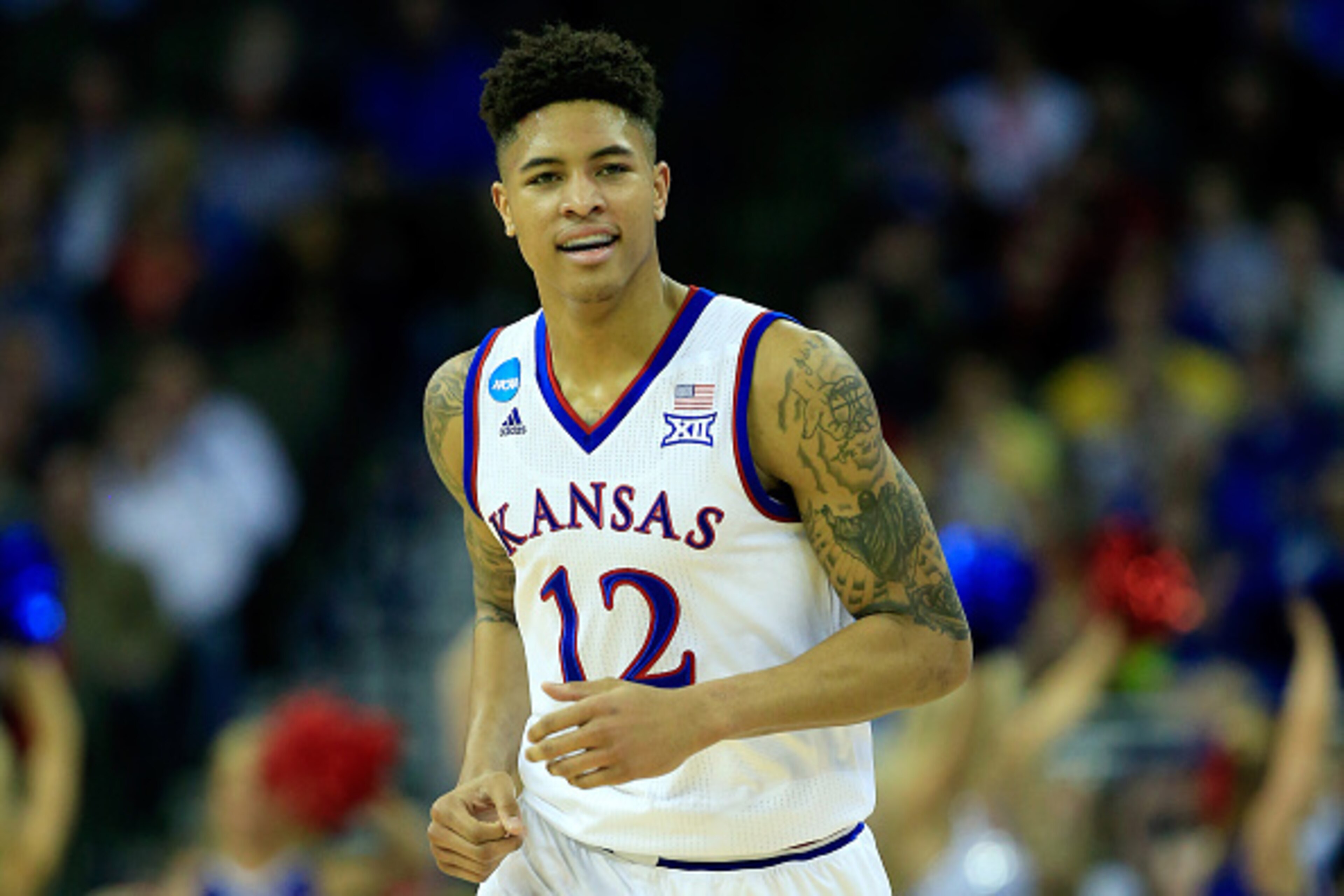 OMAHA, NE - MARCH 20: Kelly Oubre Jr. #12 of the Kansas Jayhawks reacts against the New Mexico State Aggies during the second round of the 2015 NCAA Men's Basketball Tournament at the CenturyLink Center on March 20, 2015 in Omaha, Nebraska.  (Photo by Jam