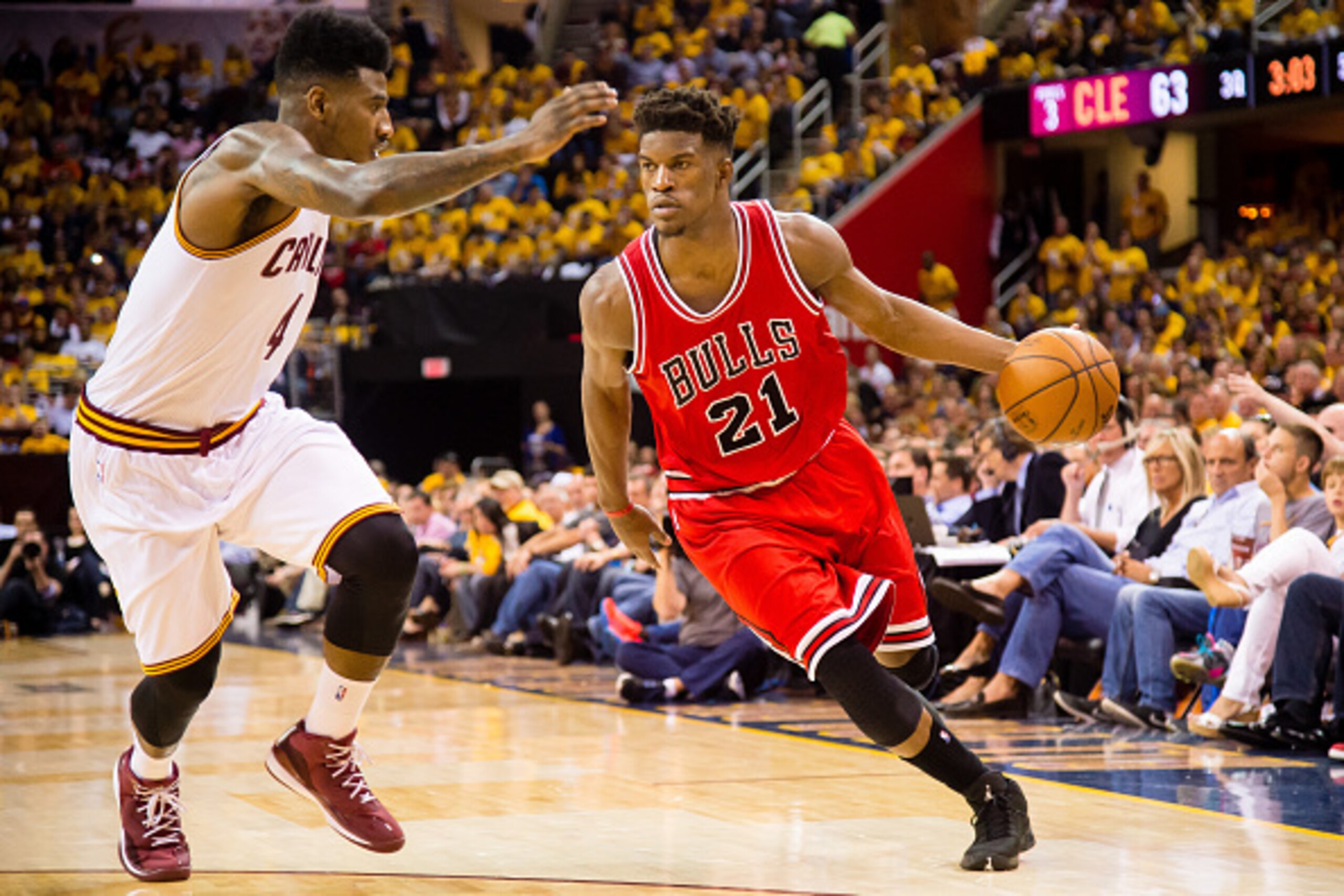 CLEVELAND, OH - MAY 4: Jimmy Butler #21 of the Chicago Bulls drives against Iman Shumpert #4 of the Cleveland Cavaliers in the second half during Game One in the Eastern Conference Semifinals of the 2015 NBA Playoffs 2015 at Quicken Loans Arena on May 4, 
