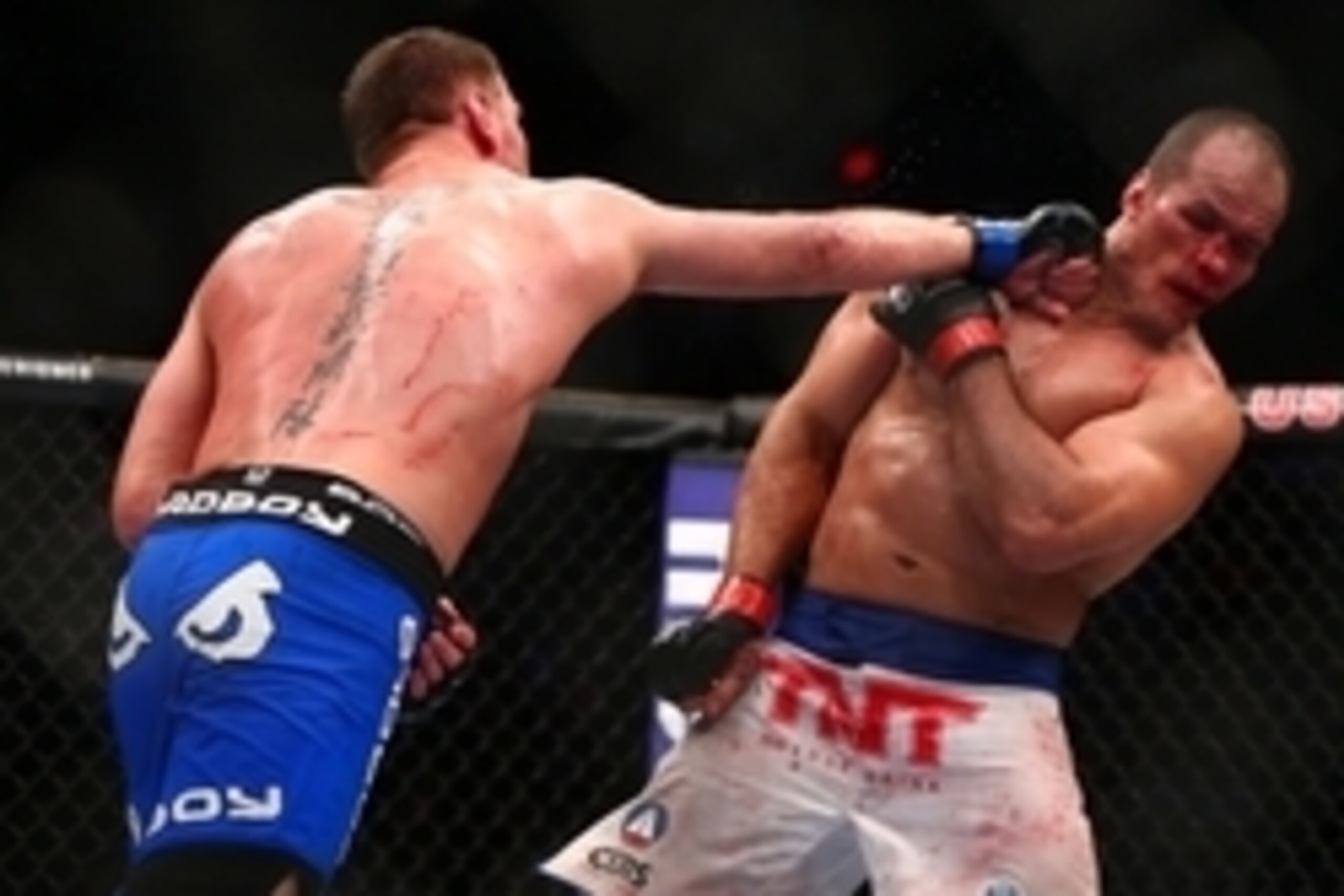 December 13, 2014; Phoenix, AZ, USA; Stipe Miocic hits Junior Dos Santos during UFC Fight Night at US Airways Center. Mandatory Credit: Mark J. Rebilas-USA TODAY Sports