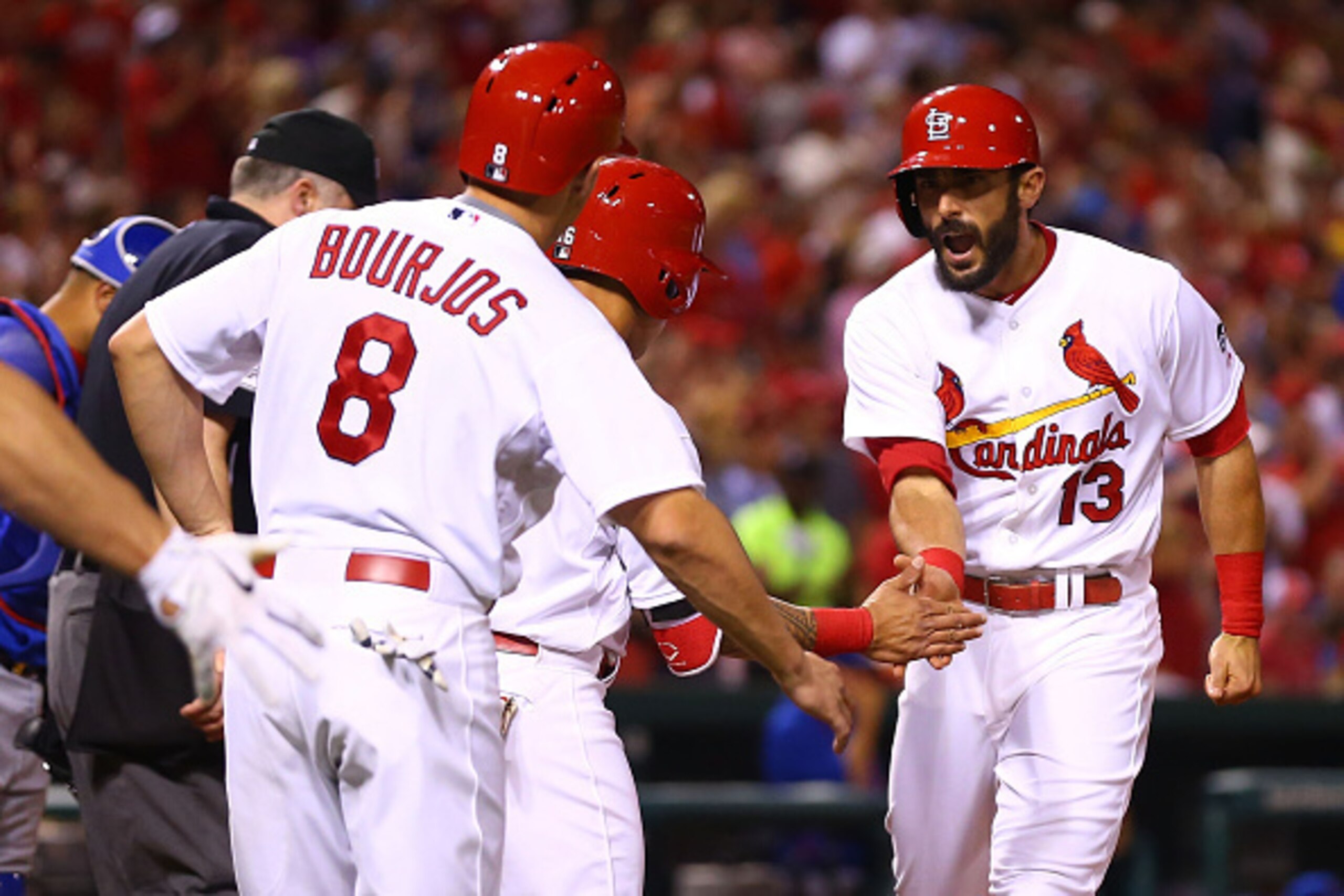 ST. LOUIS, MO - MAY 5: Matt Carpenter #13 of the St. Louis Cardinals is congratulated by teammates after hitting a three-run home run to tie the game in the fifth inning against the Chicago Cubs at Busch Stadium on May 5, 2015 in St. Louis, Missouri. (Ph ST. LOUIS, MO - MAY 5: Matt Carpenter #13 of the St. Louis Cardinals is congratulated by teammates after hitting a three-run home run to tie the game in the fifth inning against the Chicago Cubs at Busch Stadium on May 5, 2015 in St. Louis, Missouri. (Ph