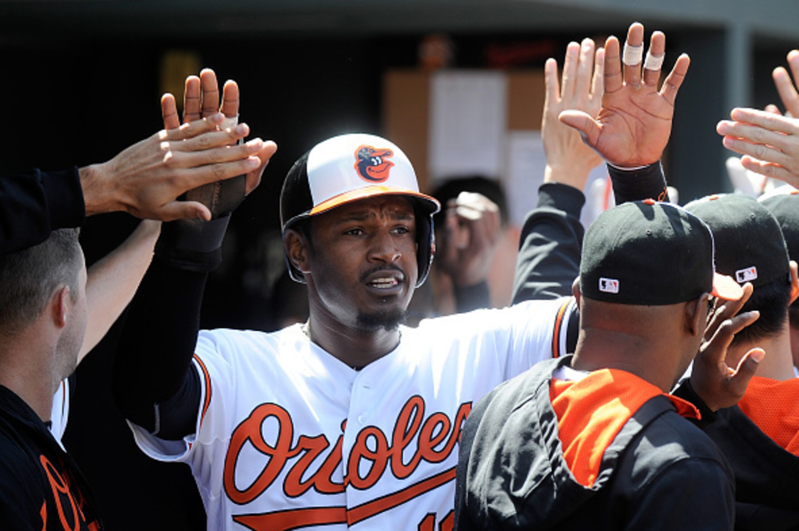 BALTIMORE, MD - APRIL 26: Adam Jones #10 of the Baltimore Orioles celebrates with teammates after scoring in the third inning against the Boston Red Sox at Oriole Park at Camden Yards on April 26, 2015 in Baltimore, Maryland. (Photo by Greg Fiume/Getty I BALTIMORE, MD - APRIL 26: Adam Jones #10 of the Baltimore Orioles celebrates with teammates after scoring in the third inning against the Boston Red Sox at Oriole Park at Camden Yards on April 26, 2015 in Baltimore, Maryland. (Photo by Greg Fiume/Getty I