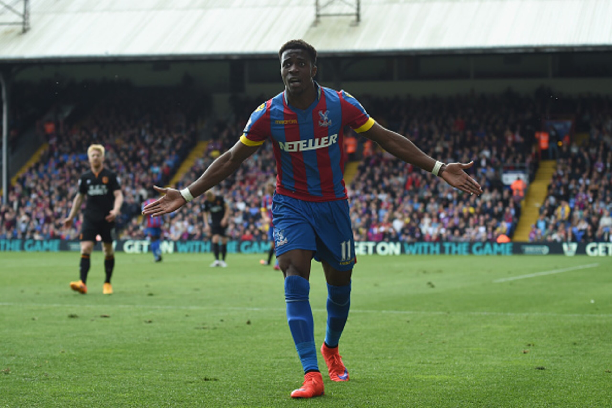 LONDON, ENGLAND - APRIL 25:  Wilfried Zaha of Crystal Palace disagrees with the linesman's decision during the Barclays Premier League match between Crystal Palace and Hull City at Selhurst Park on April 25, 2015 in London, England.  (Photo by Christopher