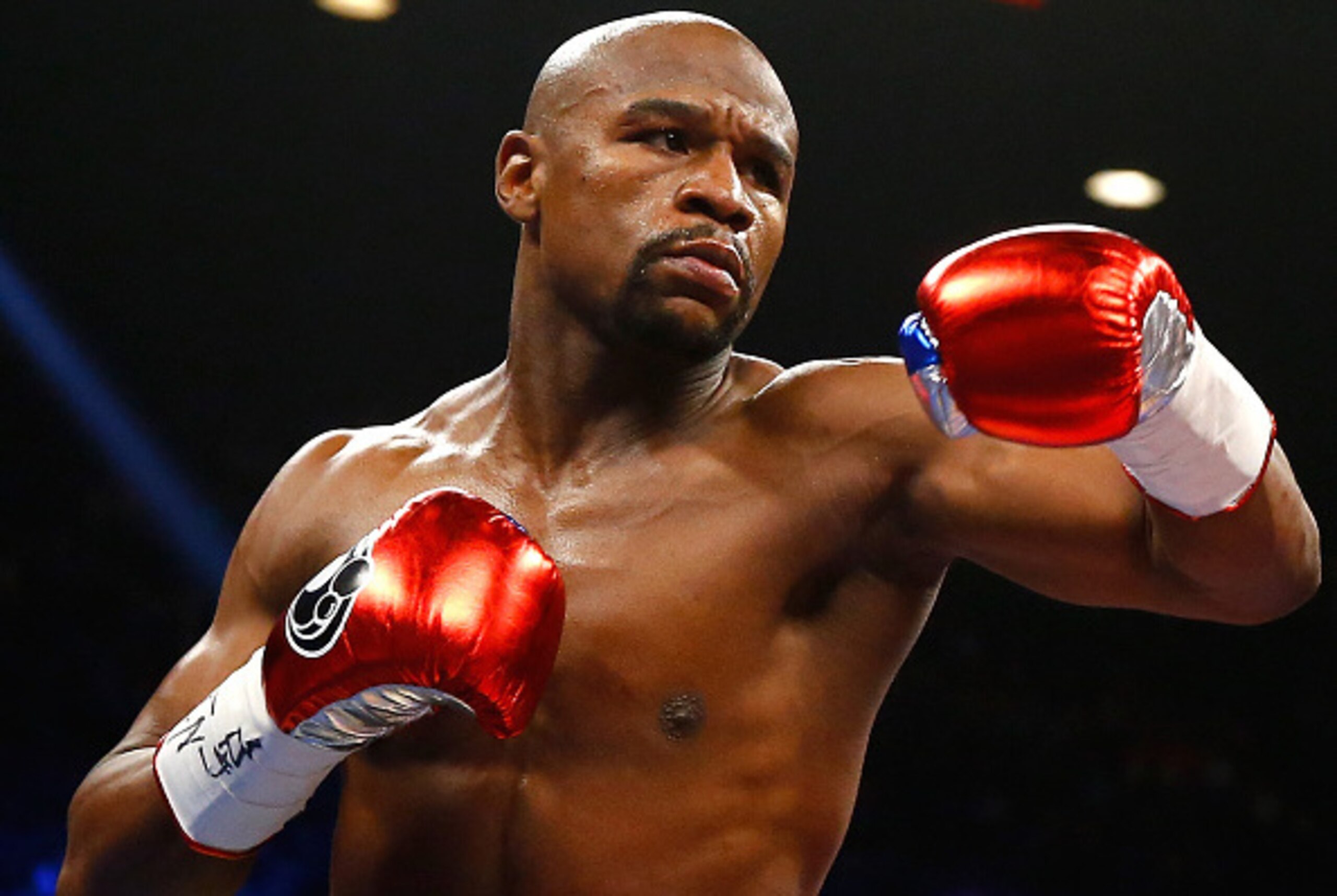 LAS VEGAS, NV - MAY 02:  Floyd Mayweather Jr. throws a left at Manny Pacquiao during their welterweight unification championship bout on May 2, 2015 at MGM Grand Garden Arena in Las Vegas, Nevada.  (Photo by Al Bello/Getty Images)