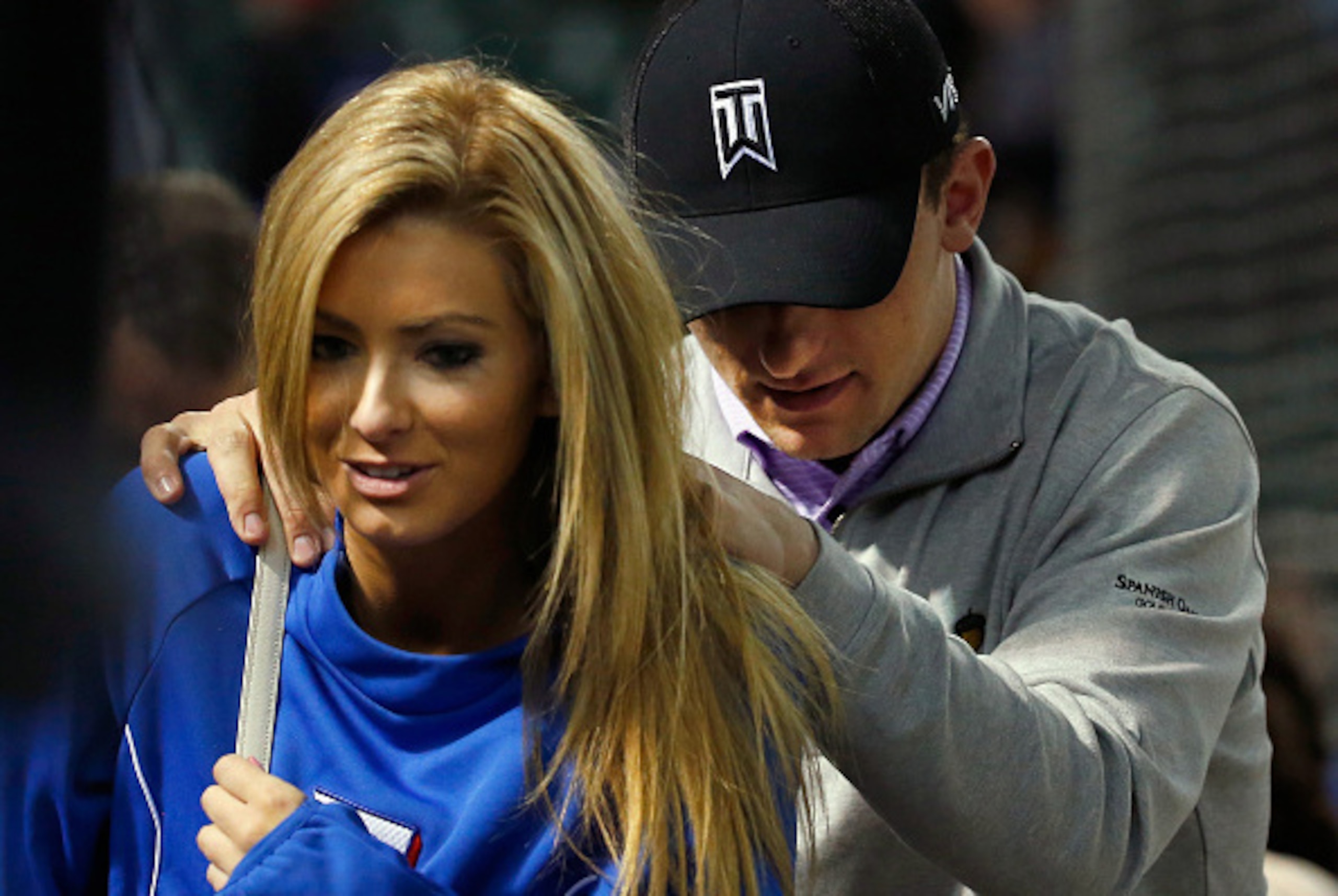 ARLINGTON, TX - APRIL 14:  Johnny Manziel quarterback of the Cleveland Browns exits the stands after the Texas Rangers beat the Los Angeles Angels 8-2 at Globe Life Park in Arlington on April 14, 2015 in Arlington, Texas.  (Photo by Tom Pennington/Getty I