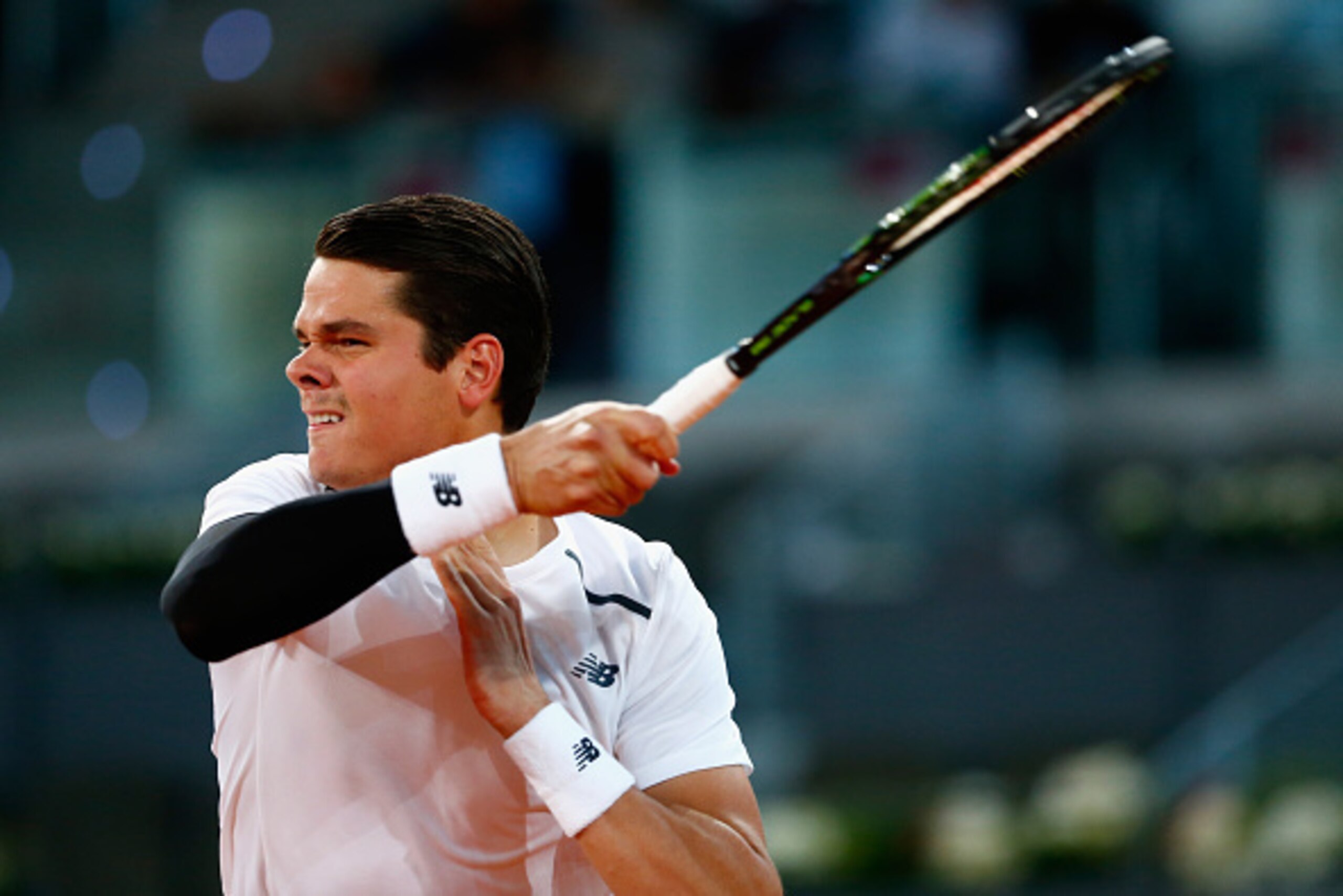 MADRID, SPAIN - MAY 07:  Milos Raonic of Canada in action against Leonardo Mayer of Argentina during day six of the Mutua Madrid Open tennis tournament at the Caja Magica on May 7, 2015 in Madrid, Spain.  (Photo by Julian Finney/Getty Images)