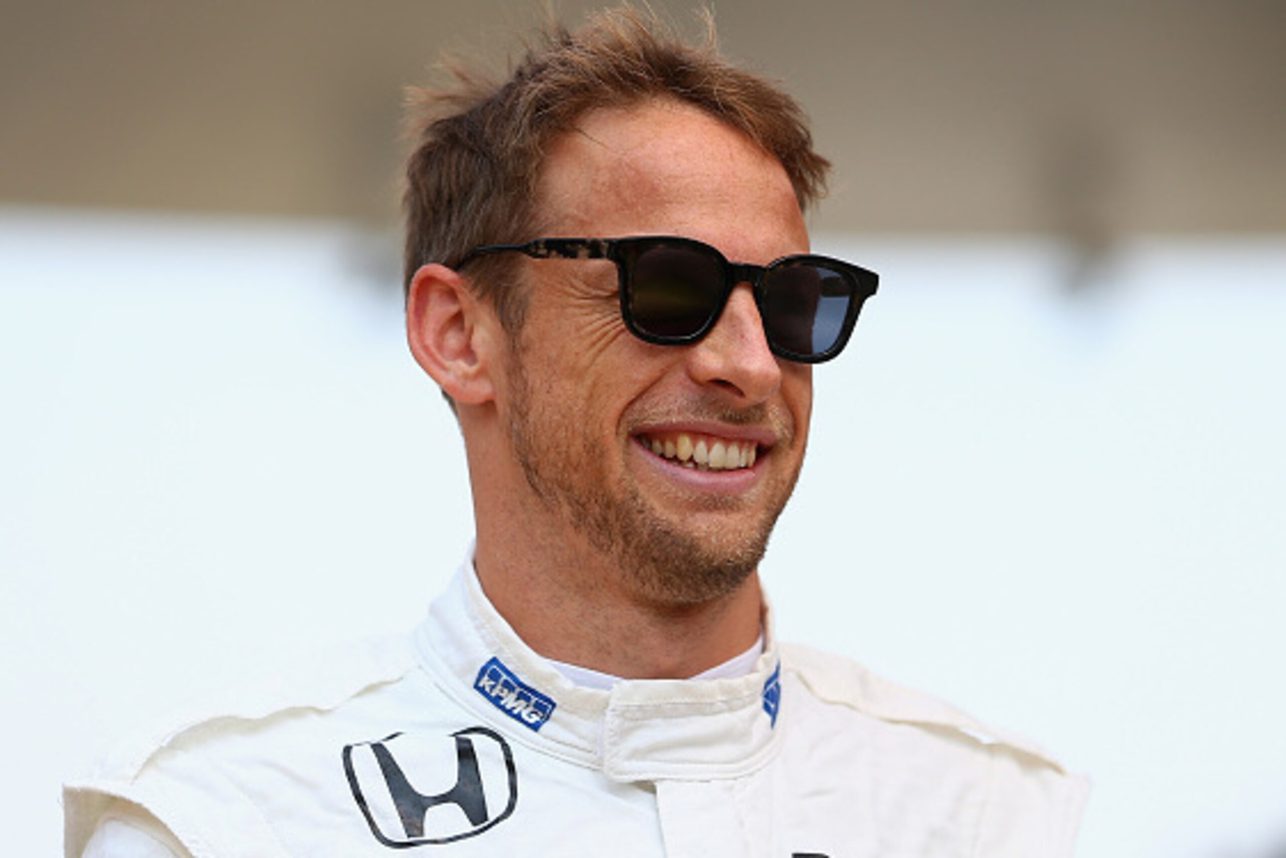 SHANGHAI, CHINA - APRIL 12:  Jenson Button of Great Britain and McLaren Honda smiles as he stands on the grid before the Formula One Grand Prix of China at Shanghai International Circuit on April 12, 2015 in Shanghai, China.  (Photo by Clive Mason/Getty I