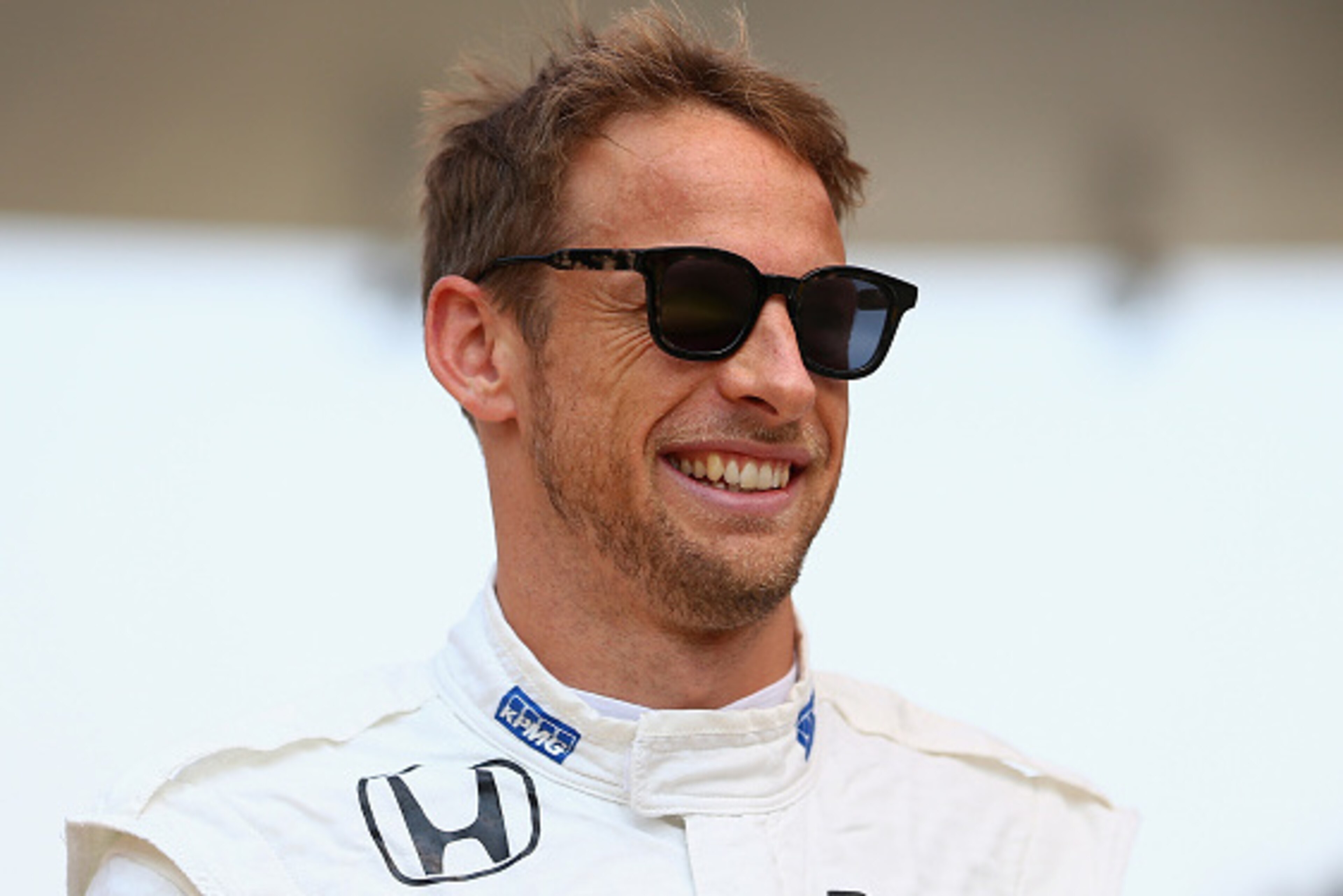 SHANGHAI, CHINA - APRIL 12:  Jenson Button of Great Britain and McLaren Honda smiles as he stands on the grid before the Formula One Grand Prix of China at Shanghai International Circuit on April 12, 2015 in Shanghai, China.  (Photo by Clive Mason/Getty I
