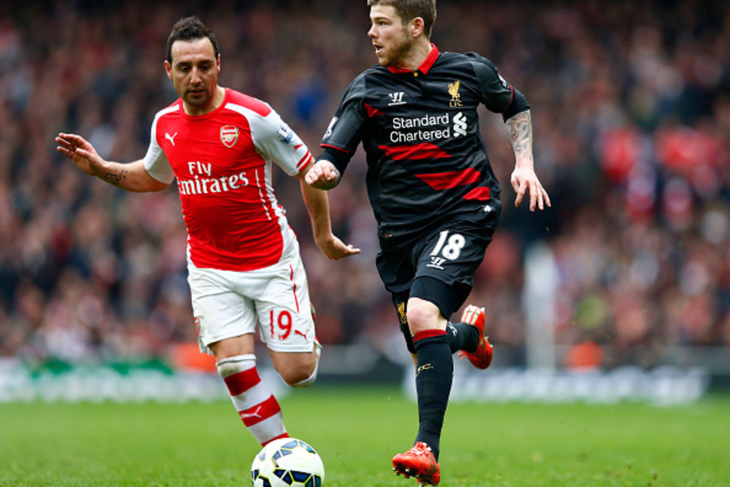 LONDON, ENGLAND - APRIL 04:  Alberto Moreno of Liverpool moves away from Santi Cazorla of Arsenal during the Barclays Premier League match between Arsenal and Liverpool at the Emirates Stadium on April 4, 2015 in London, England.  (Photo by Julian Finney/