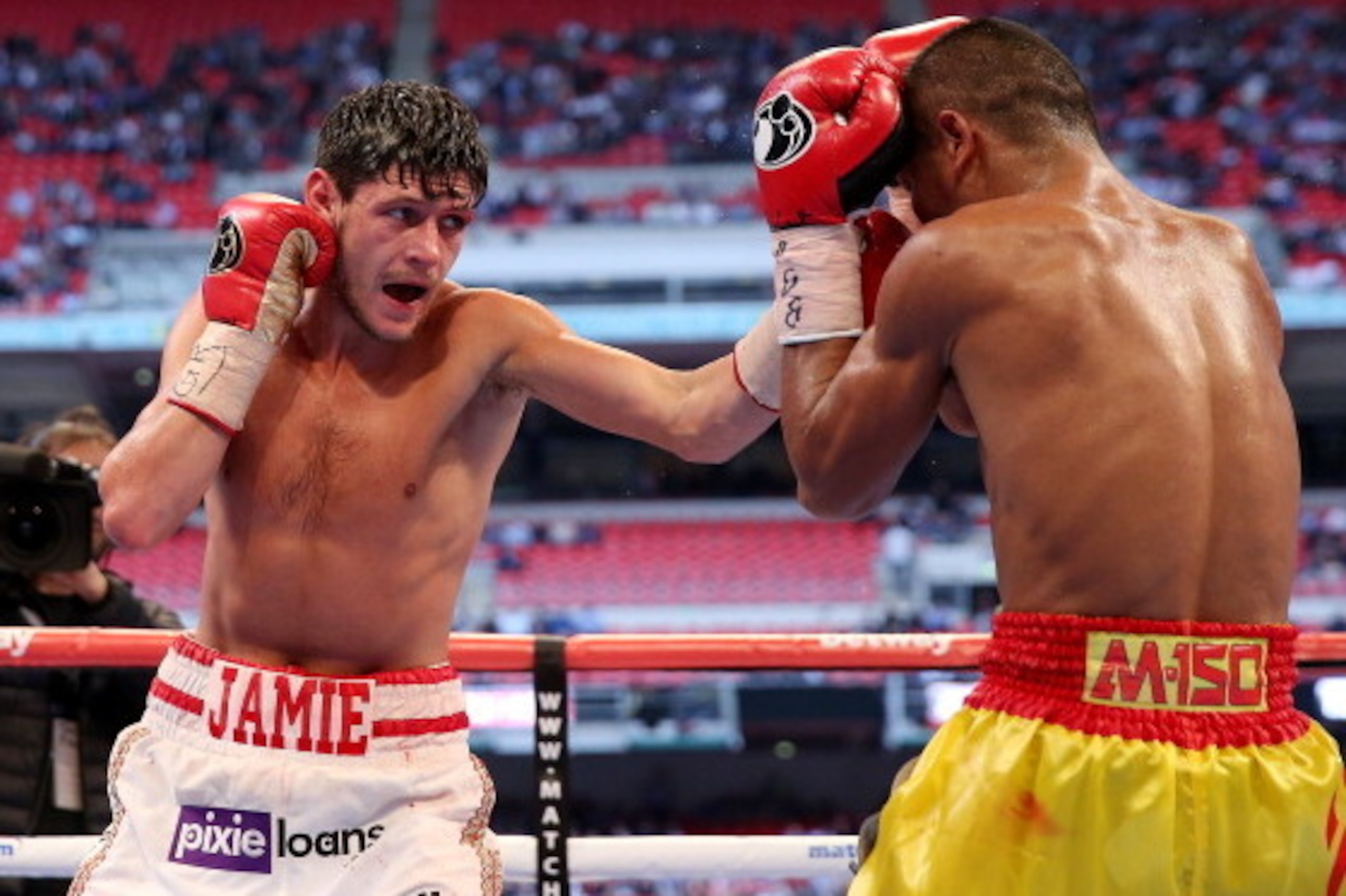 LONDON, ENGLAND - MAY 31: Jamie McDonnell in action with Tabtimdaeng Na Rachawat during their Vacant WBA World Bantamweight Championship bout at Wembley Stadium on May 31, 2014 in London, England. (Photo by Scott Heavey/Getty Images) LONDON, ENGLAND - MAY 31: Jamie McDonnell in action with Tabtimdaeng Na Rachawat during their Vacant WBA World Bantamweight Championship bout at Wembley Stadium on May 31, 2014 in London, England. (Photo by Scott Heavey/Getty Images)