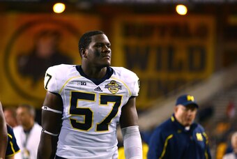 Dec 28, 2013; Tempe, AZ, USA; Michigan Wolverines defensive end Frank Clark against the Kansas State Wildcats during the Buffalo Wild Wings Bowl at Sun Devil Stadium. Mandatory Credit: Mark J. Rebilas-USA TODAY Sports