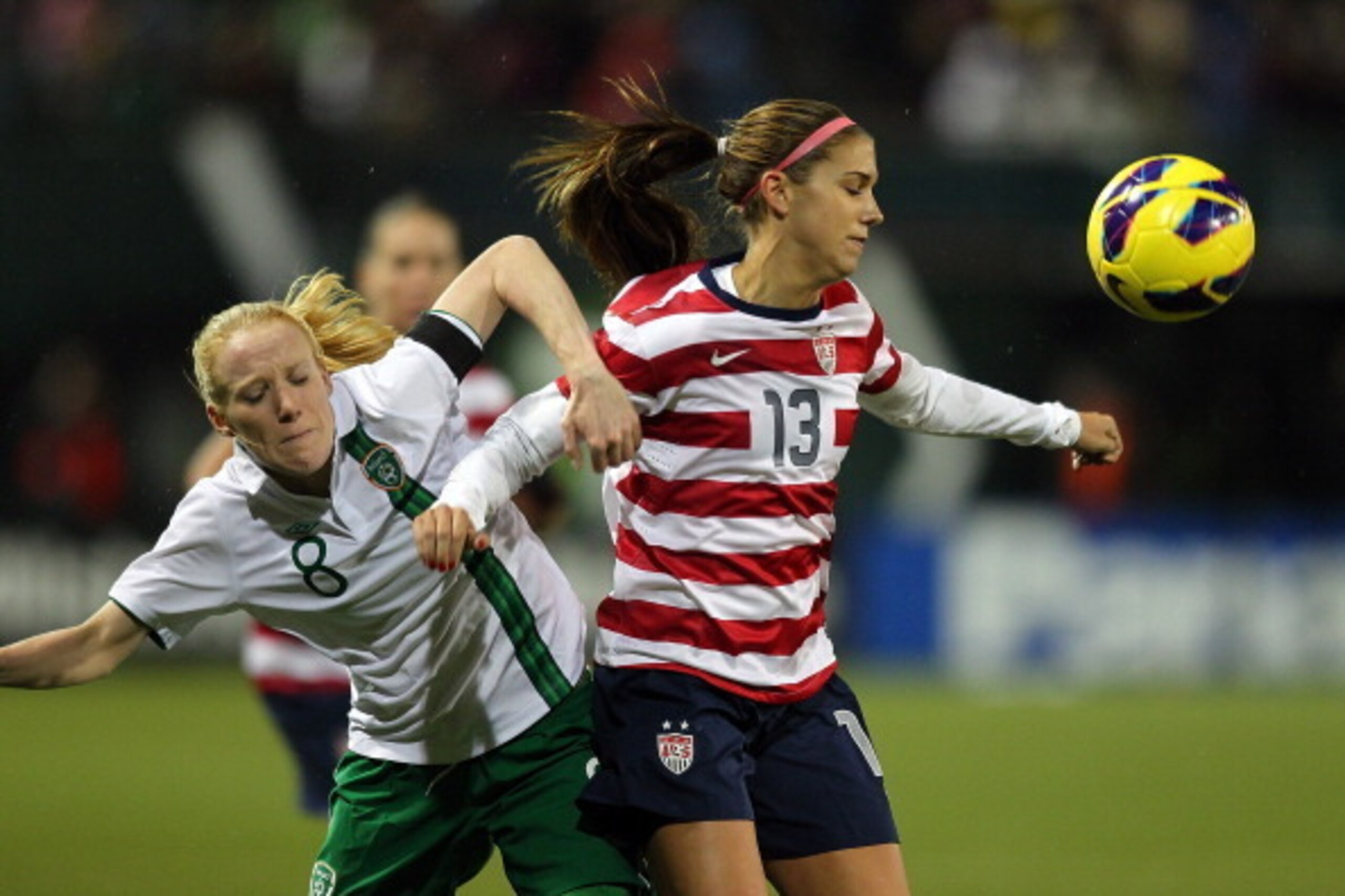 PORTLAND, OR - NOVEMBER 28:  Alex Morgan #13 of the United States battles Meabh De Burca #8 of Ireland on November 28, 2012 at Jeld-Wen Field in Portland, Oregon.  (Photo by Jonathan Ferrey/Getty Images)