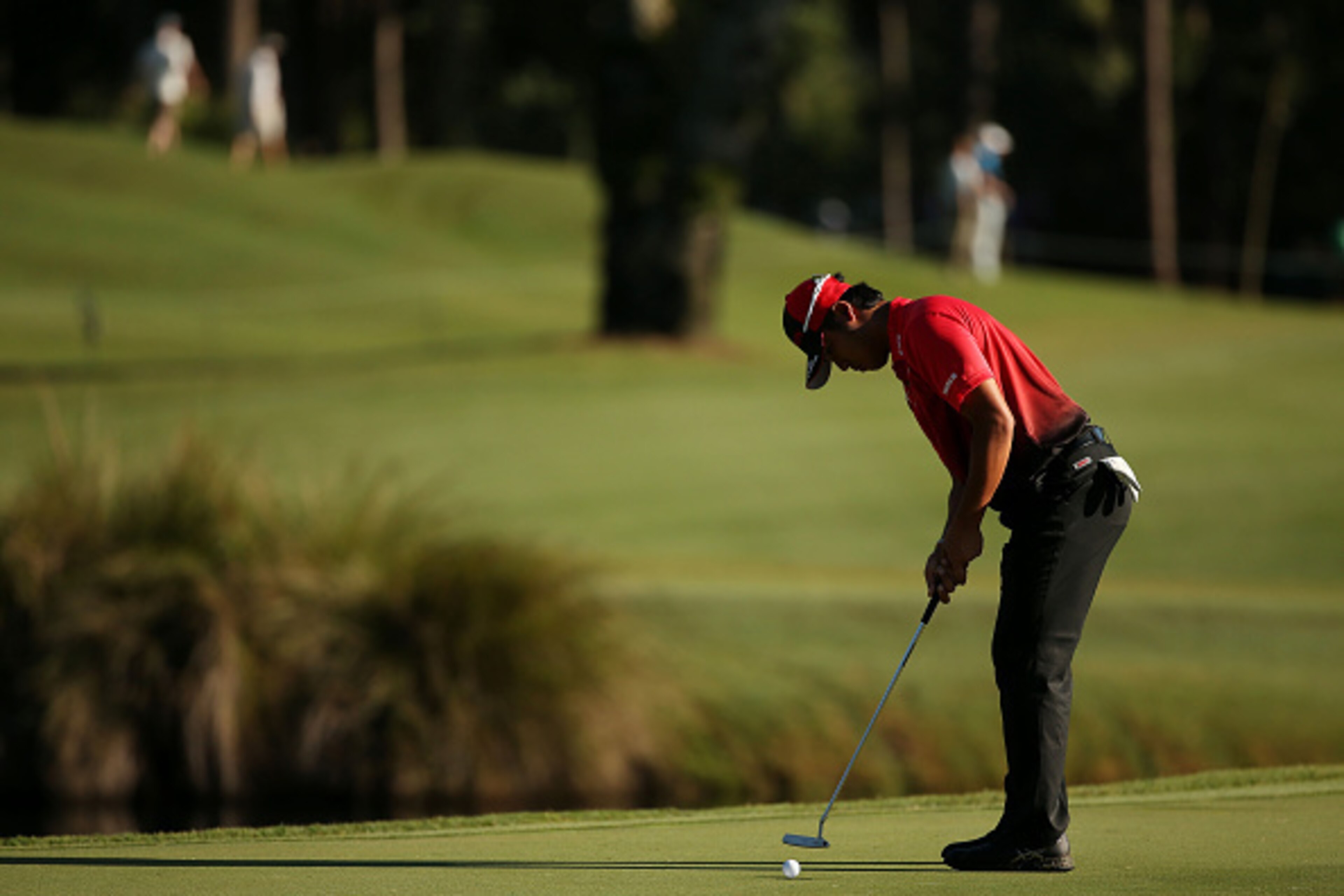 PONTE VEDRA BEACH, FL - MAY 07:  Hideki Matsuyama of Japan putts on the 11th green during round one of THE PLAYERS Championship at the TPC Sawgrass Stadium course on May 7, 2015 in Ponte Vedra Beach, Florida.  (Photo by Mike Ehrmann/Getty Images)