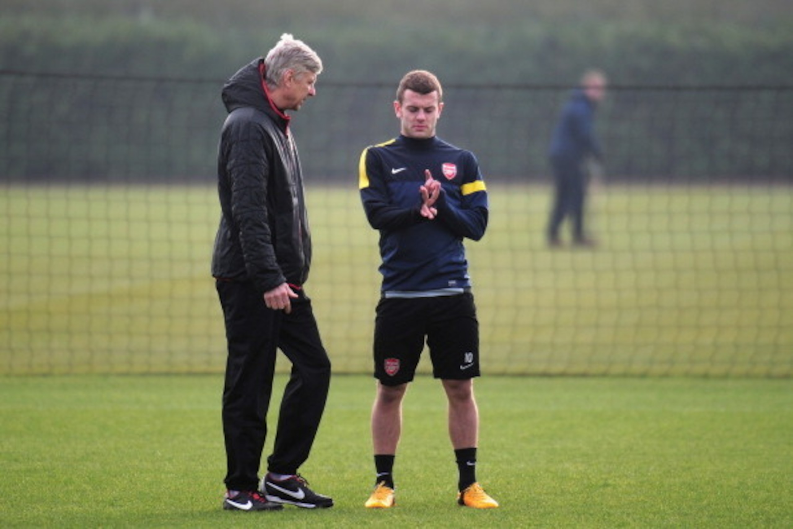 ST ALBANS, ENGLAND - FEBRUARY 18: Arsenal manager Arsene Wenger talks to Jack Wilshere during a training session ahead of their UEFA Champions League round of 16 first leg match against FC Bayern Muenchen at London Colney on February 18, 2013 in St Alban ST ALBANS, ENGLAND - FEBRUARY 18: Arsenal manager Arsene Wenger talks to Jack Wilshere during a training session ahead of their UEFA Champions League round of 16 first leg match against FC Bayern Muenchen at London Colney on February 18, 2013 in St Alban