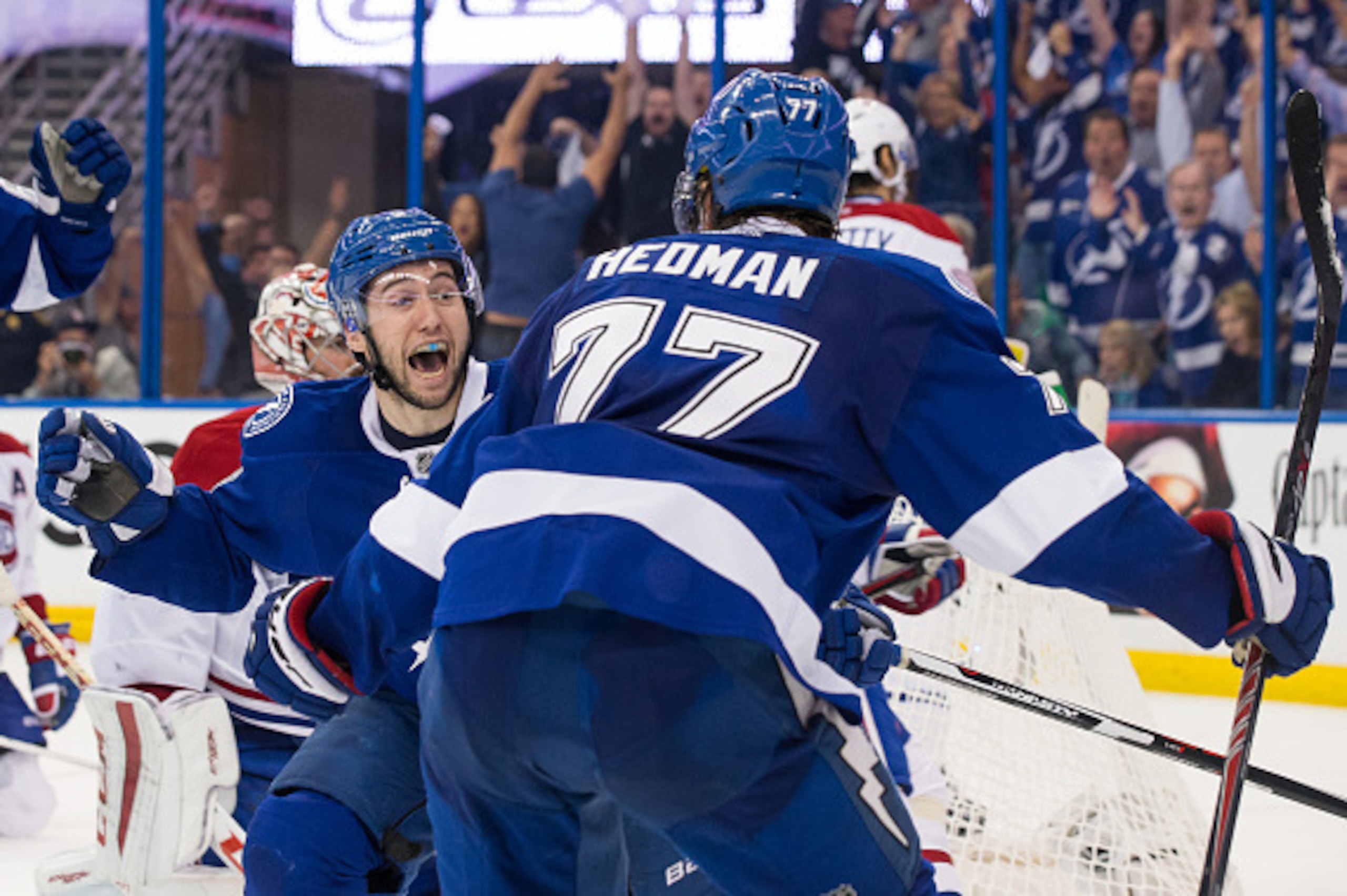 TAMPA, FL - May 6: Tyler Johnson #9 of the Tampa Bay Lightning celebrates his game winning goal with teammate Victor Hedman #77 against the Montreal Canadiens during the third period in Game Three of the Eastern Conference Semifinals during the 2015 NHL S