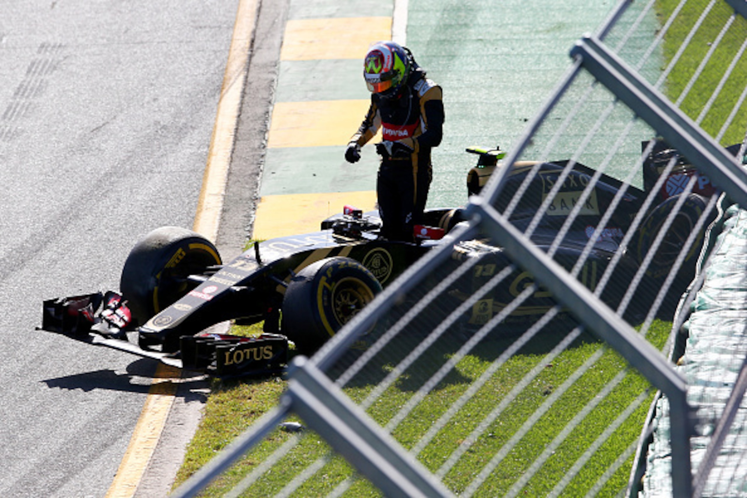 MELBOURNE, AUSTRALIA - MARCH 15: Pastor Maldonado of Venezuela and Lotus crashes at the second corner during the Australian Formula One Grand Prix at Albert Park on March 15, 2015 in Melbourne, Australia. (Photo by Mark Thompson/Getty Images) MELBOURNE, AUSTRALIA - MARCH 15: Pastor Maldonado of Venezuela and Lotus crashes at the second corner during the Australian Formula One Grand Prix at Albert Park on March 15, 2015 in Melbourne, Australia. (Photo by Mark Thompson/Getty Images)