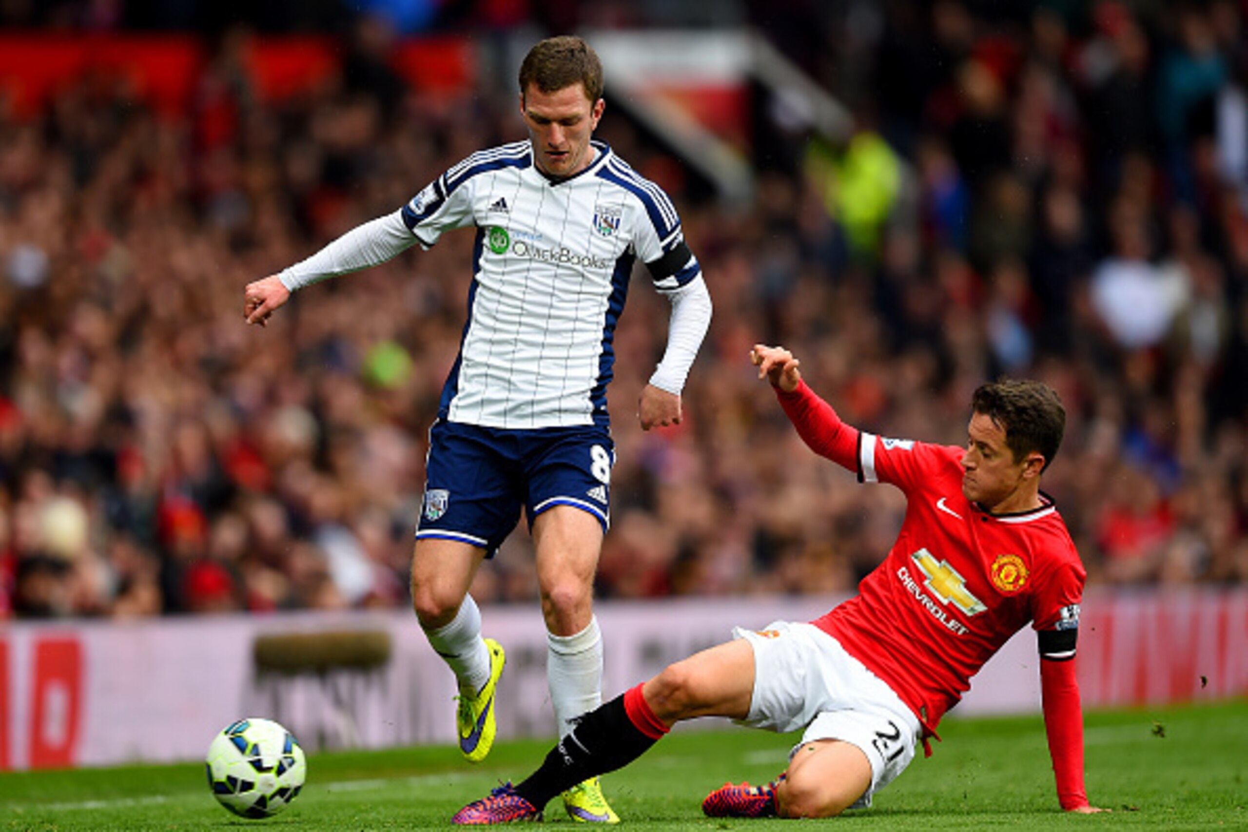 MANCHESTER, ENGLAND - MAY 02:  Ander Herrera of Manchester United slides in on Craig Gardner of West Brom during the Barclays Premier League match between Manchester United and West Bromwich Albion at Old Trafford on May 2, 2015 in Manchester, England.  (