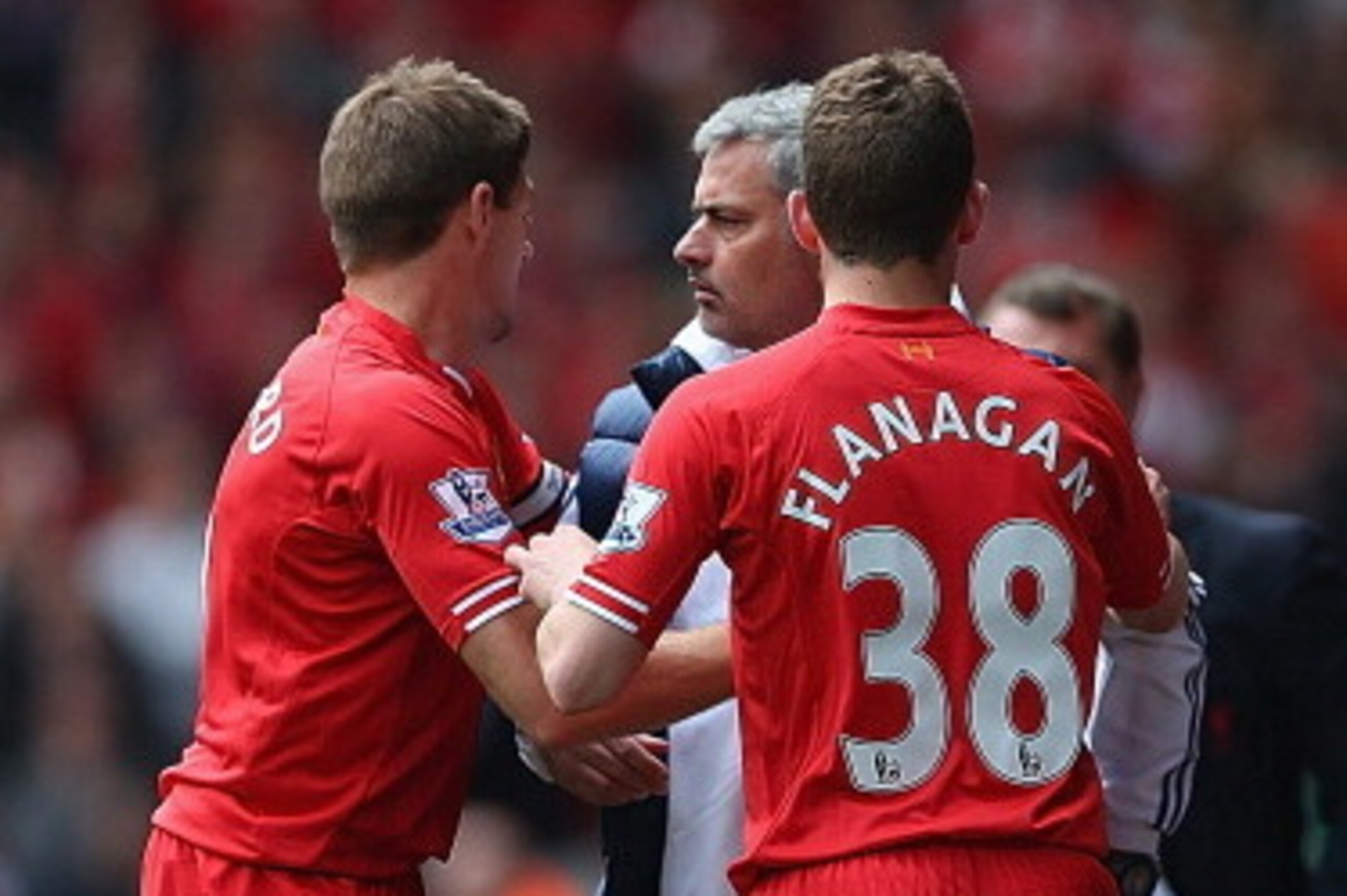 LIVERPOOL, ENGLAND - APRIL 27:  Steven Gerrard and Jon Flanagan of Liverpool have words with Jose Mourinho manager of Chelsea as they retrieve the ball to take a Liverpool throw in during the Barclays Premier League match between Liverpool and Chelsea at 