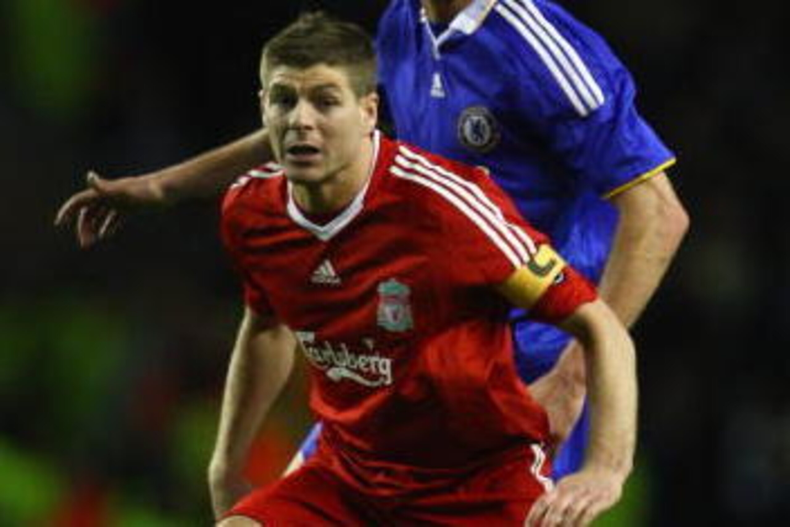 LIVERPOOL, UNITED KINGDOM - APRIL 08:  Michael Ballack of Chelsea pressurises Steven Gerrard of Liverpool during the UEFA Champions League Quarter Final First Leg match between Liverpool and Chelsea at Anfield on April 8, 2009 in Liverpool, England. (Phot
