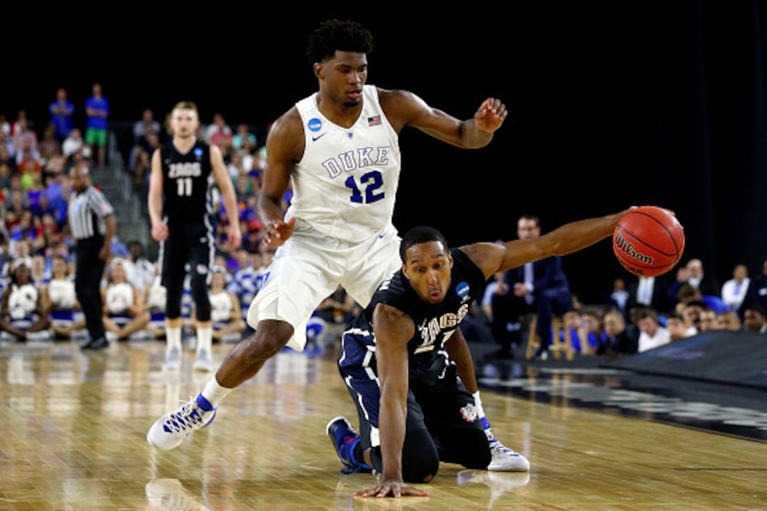 HOUSTON, TX - MARCH 29:  Justise Winslow #12 of the Duke Blue Devils defends against Eric McClellan #21 of the Gonzaga Bulldogs during the South Regional Final of the 2015 NCAA Men's Basketball Tournament at NRG Stadium on March 29, 2015 in Houston, Texas