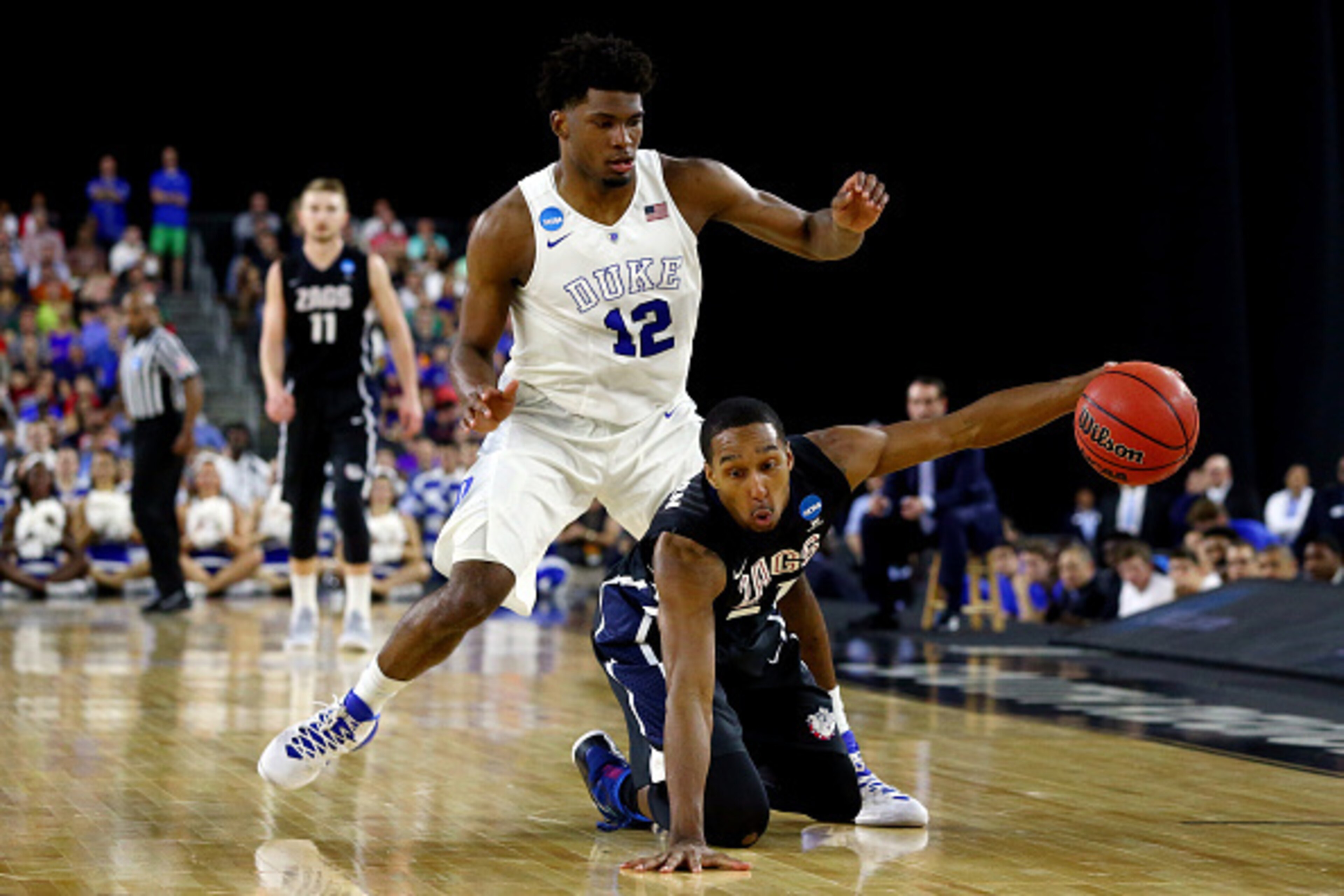 HOUSTON, TX - MARCH 29:  Justise Winslow #12 of the Duke Blue Devils defends against Eric McClellan #21 of the Gonzaga Bulldogs during the South Regional Final of the 2015 NCAA Men's Basketball Tournament at NRG Stadium on March 29, 2015 in Houston, Texas