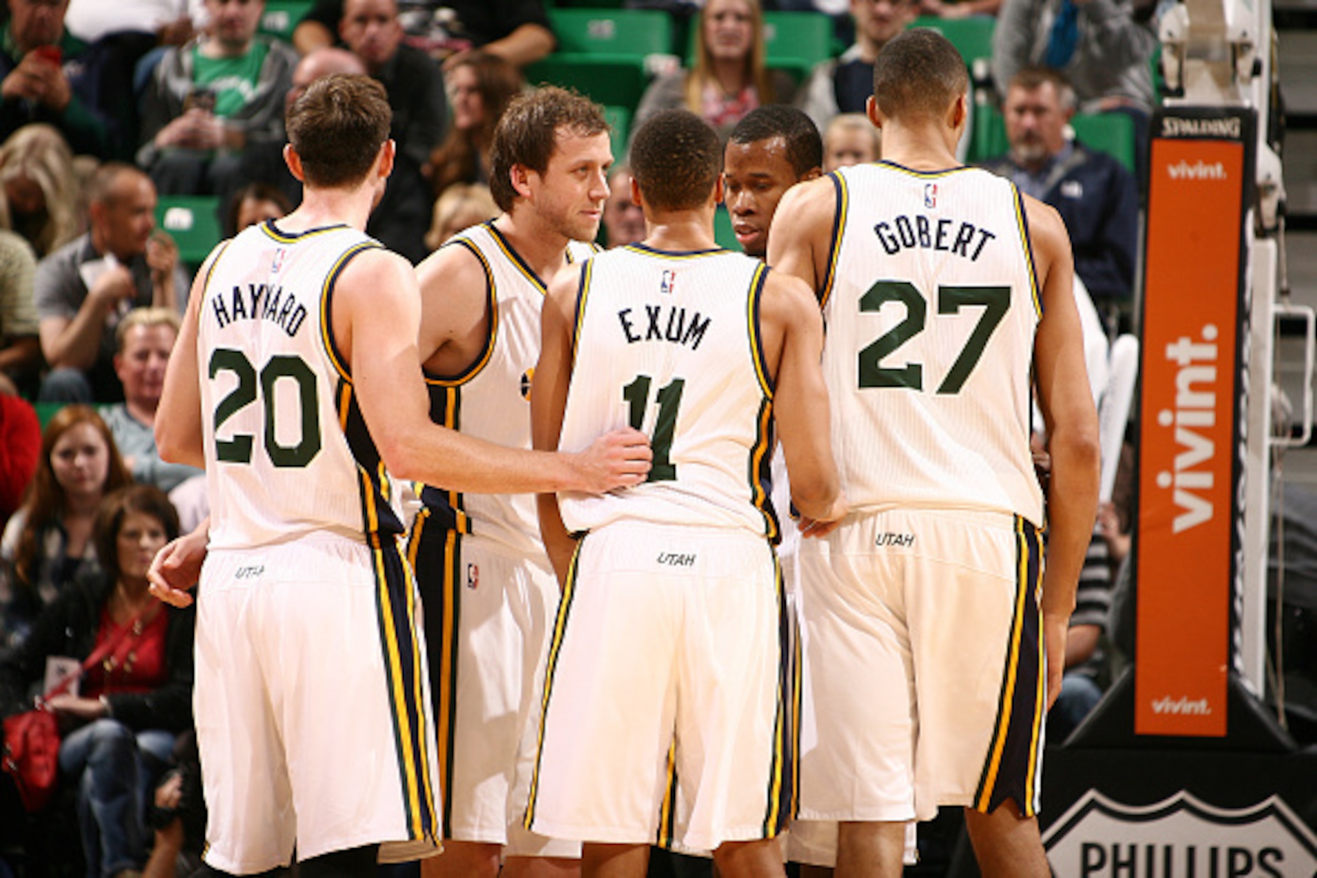 SALT LAKE CITY, UT - NOVEMBER 01: Dante Exum #11, Rudy Gobert #27, and Gordon Hayward #20 of the Utah Jazz speak with teammates during a break in action against the Phoenix Suns at EnergySolutions Arena on November 01, 2014 in Salt Lake City, Utah. NOTE T